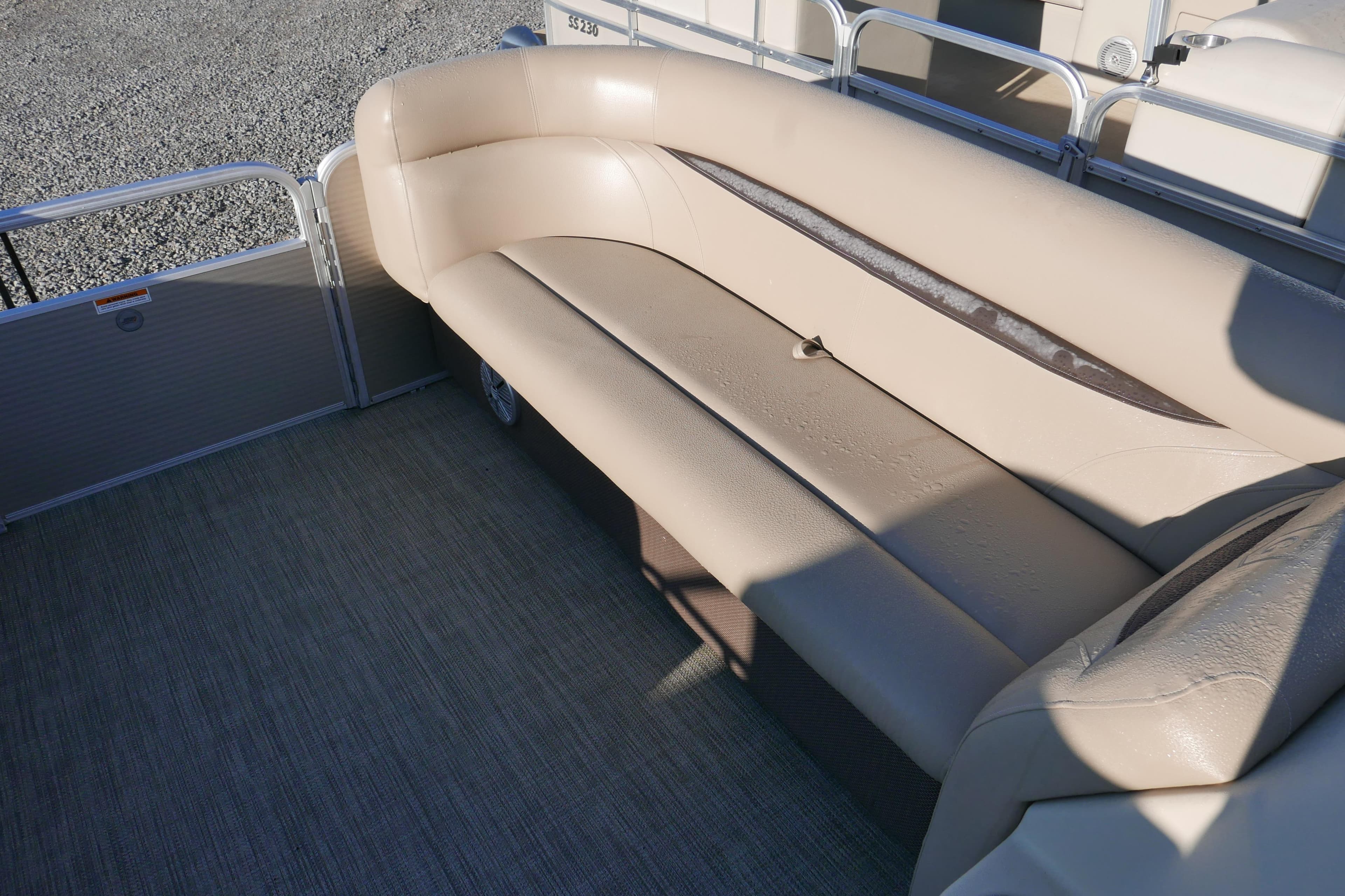 Beige seating on 2018 Sweetwater SW2086c pontoon boat, outdoor setting.