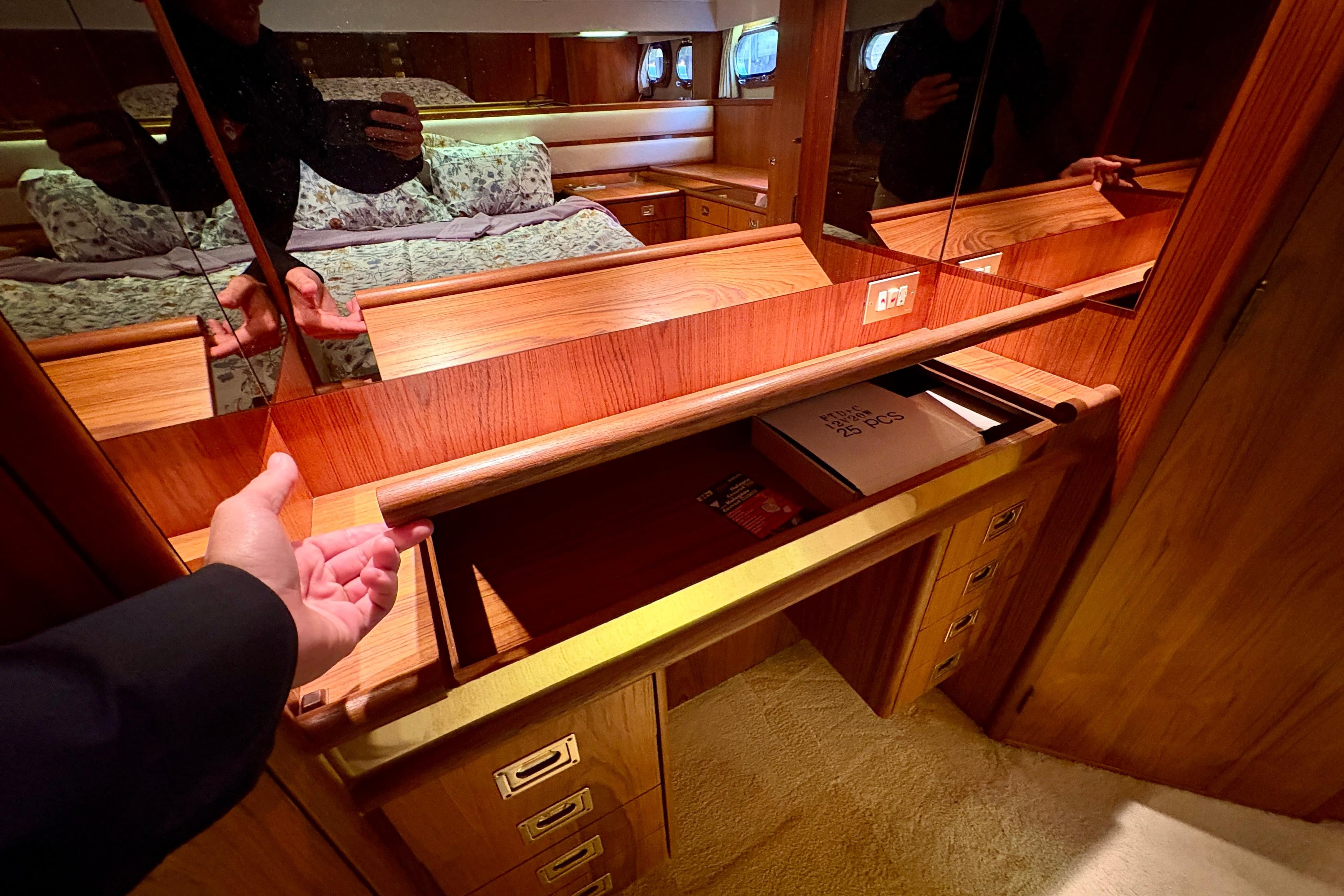 Luxury wooden interior of 1990 Neptunus 145 AC yacht with storage compartment.