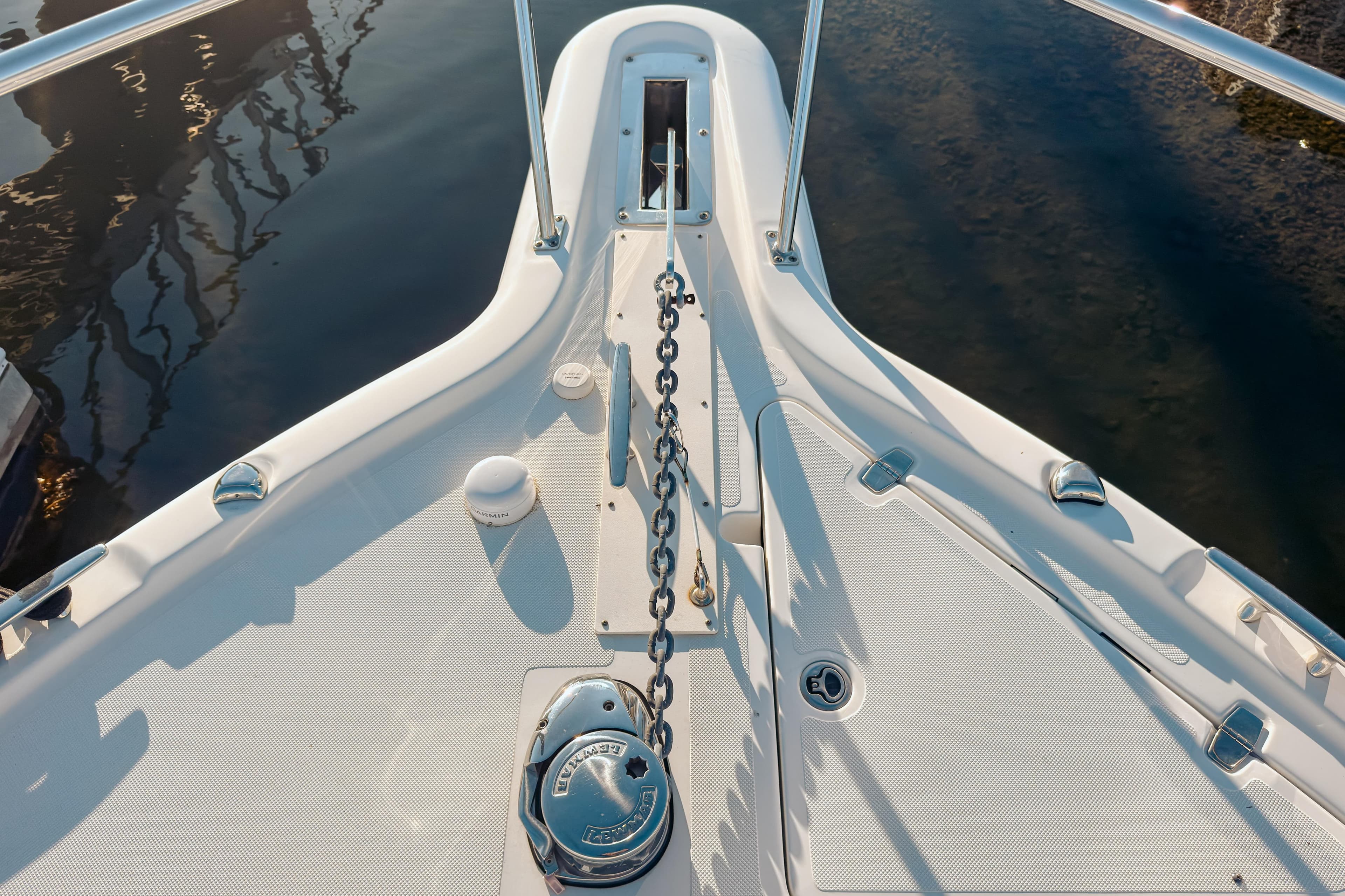 Bow view of 2021 Pursuit OS 385 Offshore boat with anchor chain and deck details.