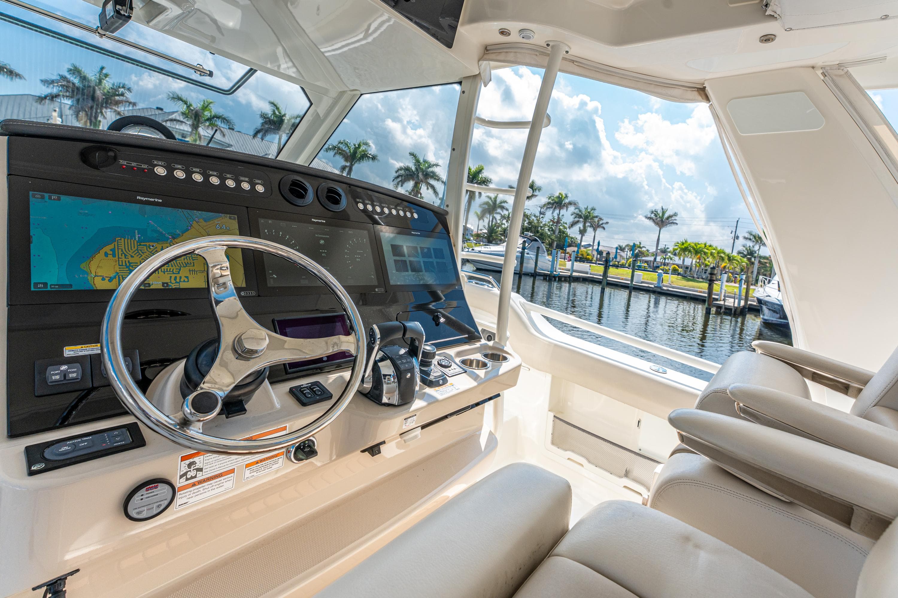 2019 Boston Whaler 420 Outrage helm with advanced navigation system and luxurious seating.
