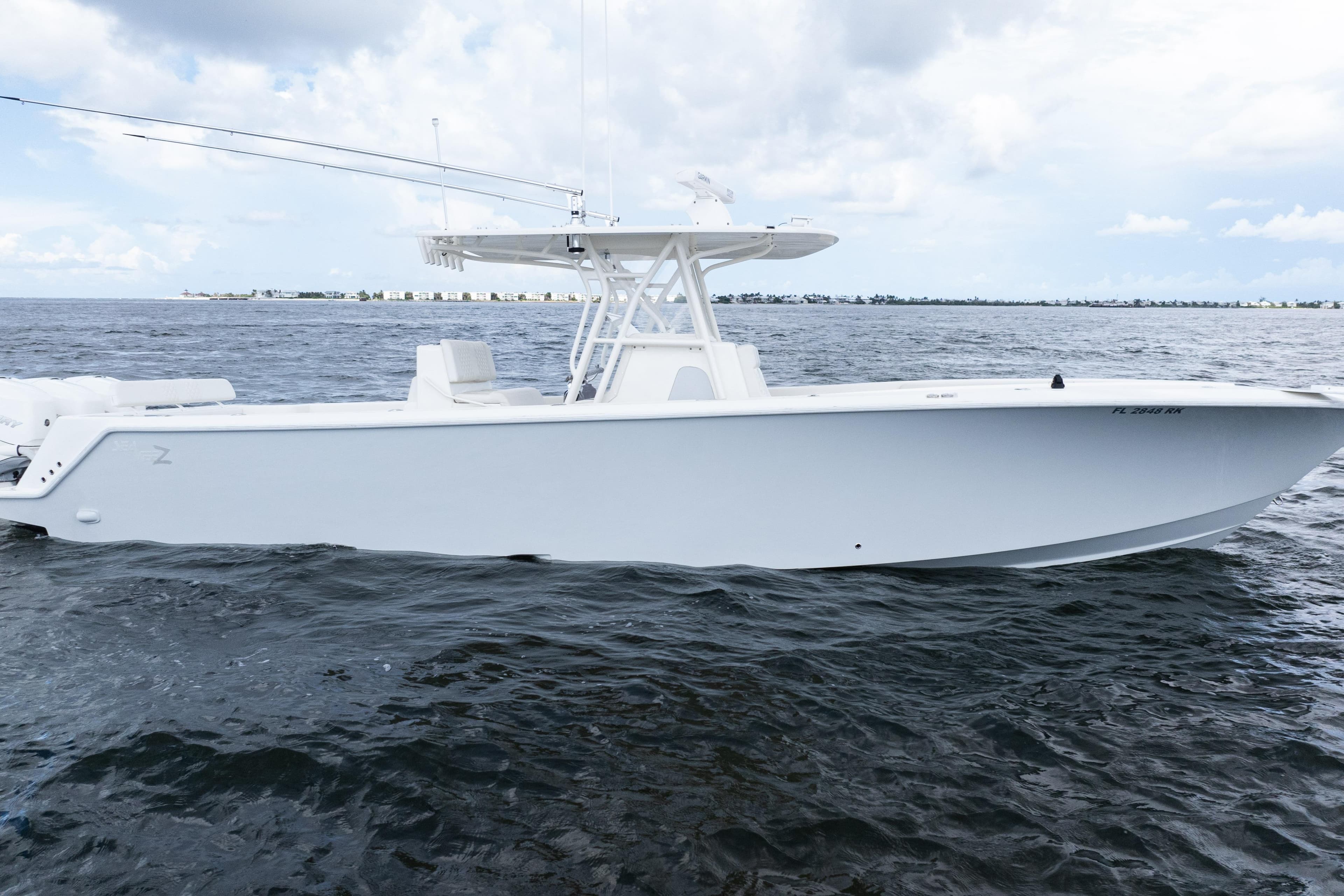 2017 SeaVee 370z boat on open water under cloudy sky.
