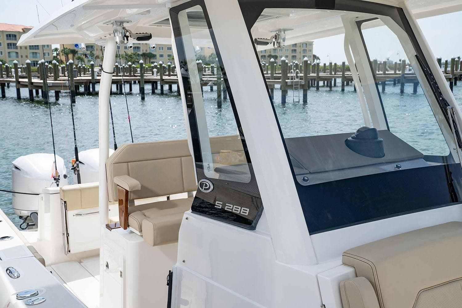 Manufacturer Provided Image: 2025 Pursuit S 288 Sport boat docked, featuring sleek design and comfortable seating.