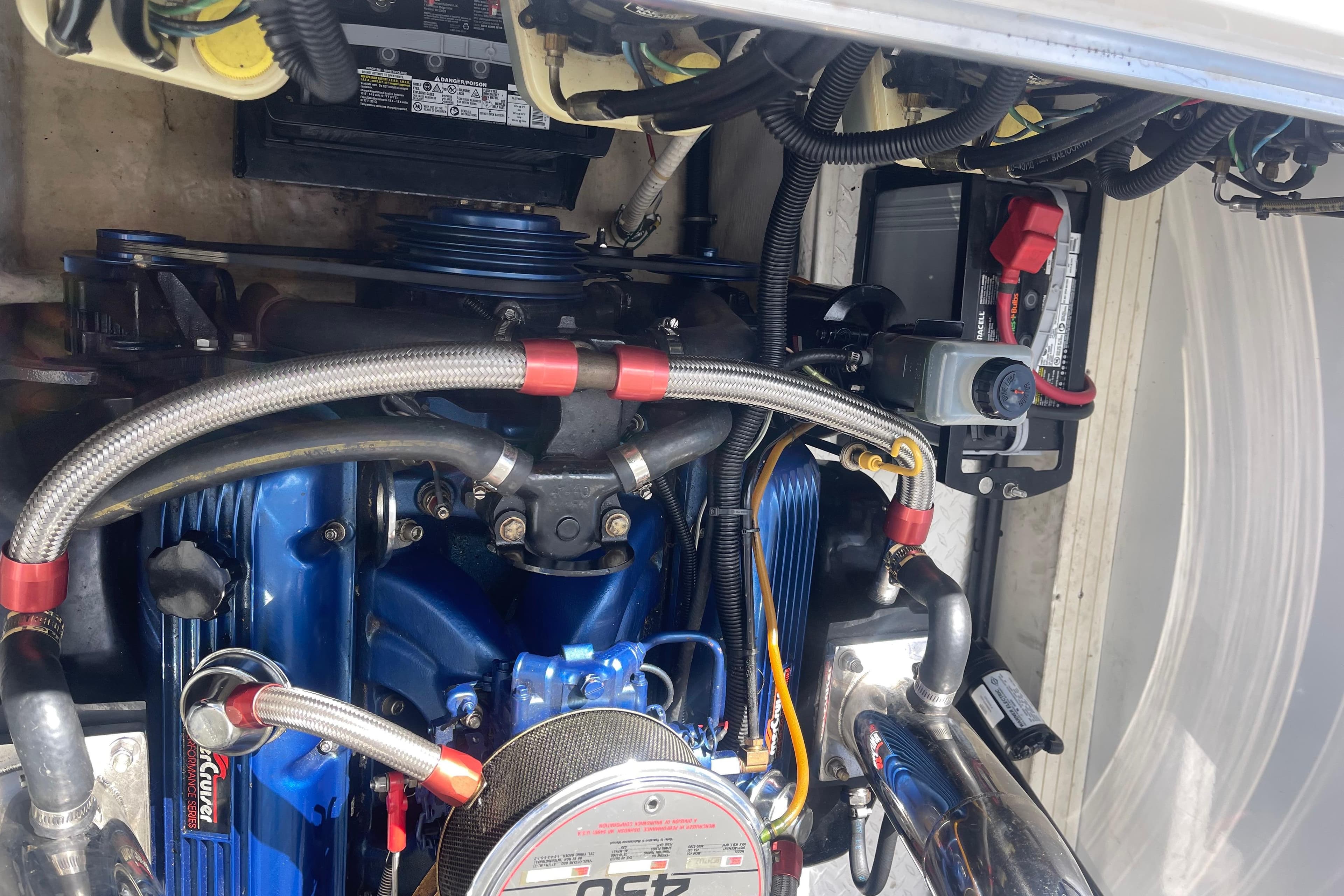 Engine compartment of a 1995 Excel Scarab 43 boat, showcasing detailed components.