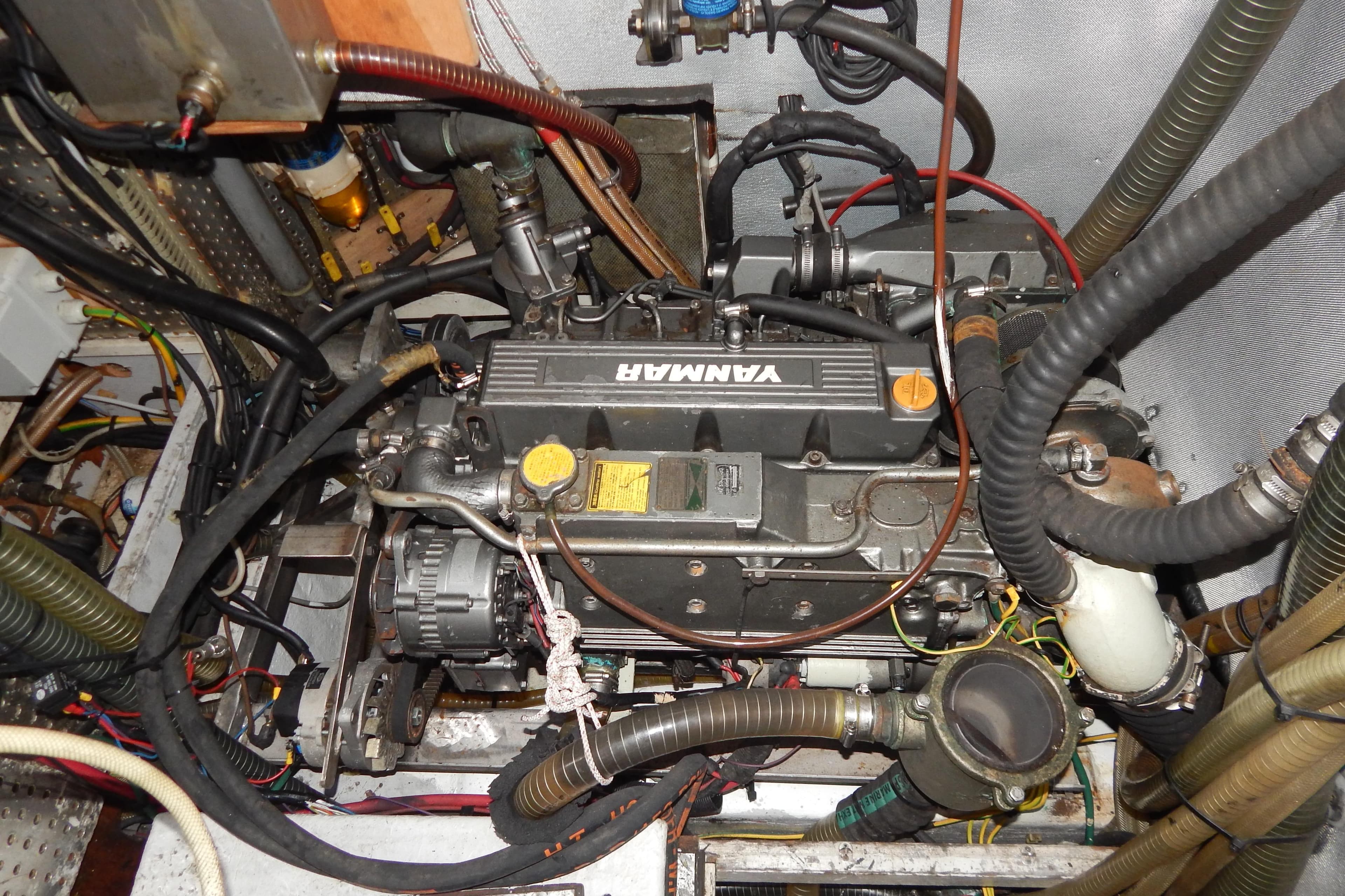 Engine compartment of a 1992 Tayana 55 sailboat with Yanmar engine.