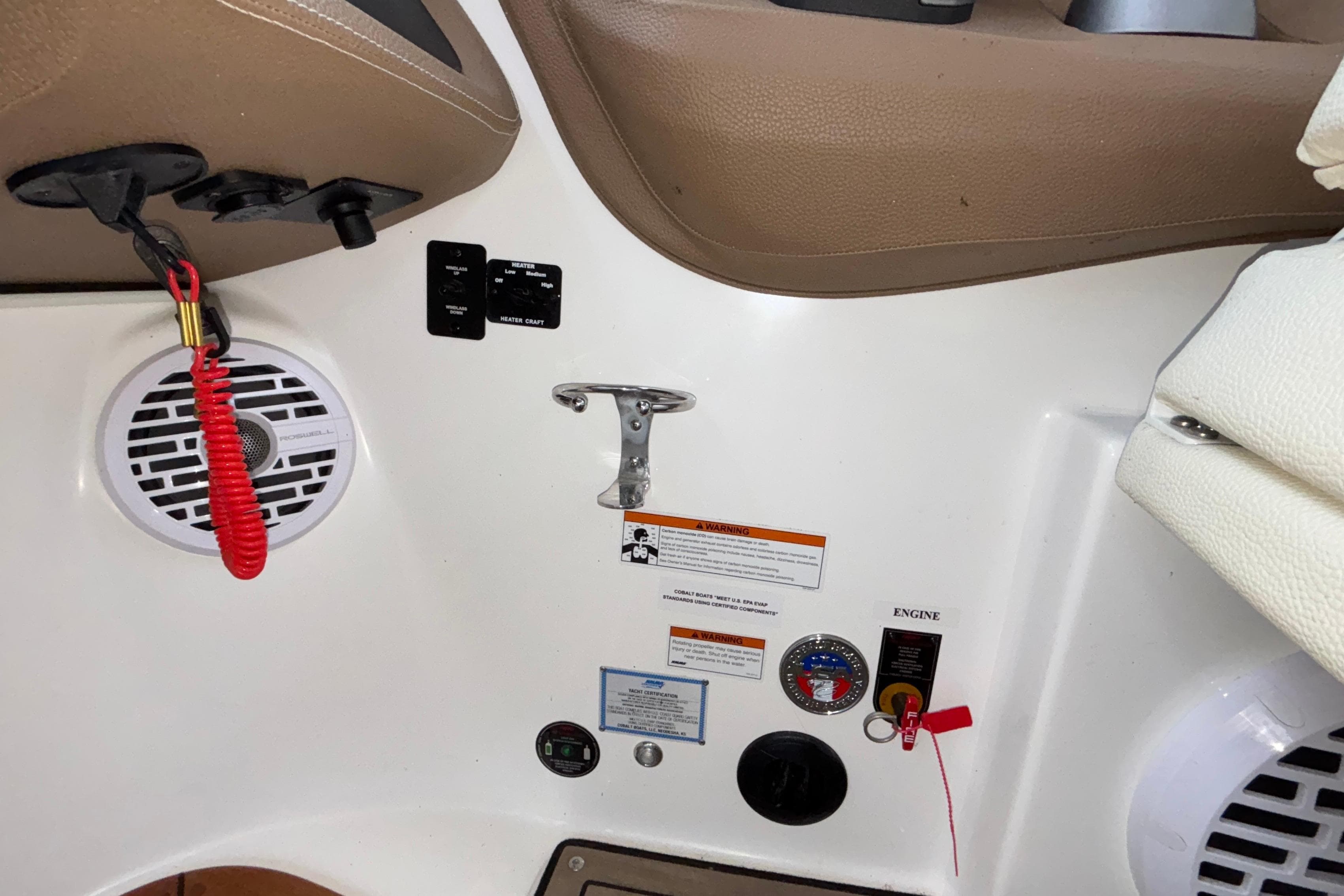 Interior of a 2022 Cobalt R35 boat with control panel and safety features.
