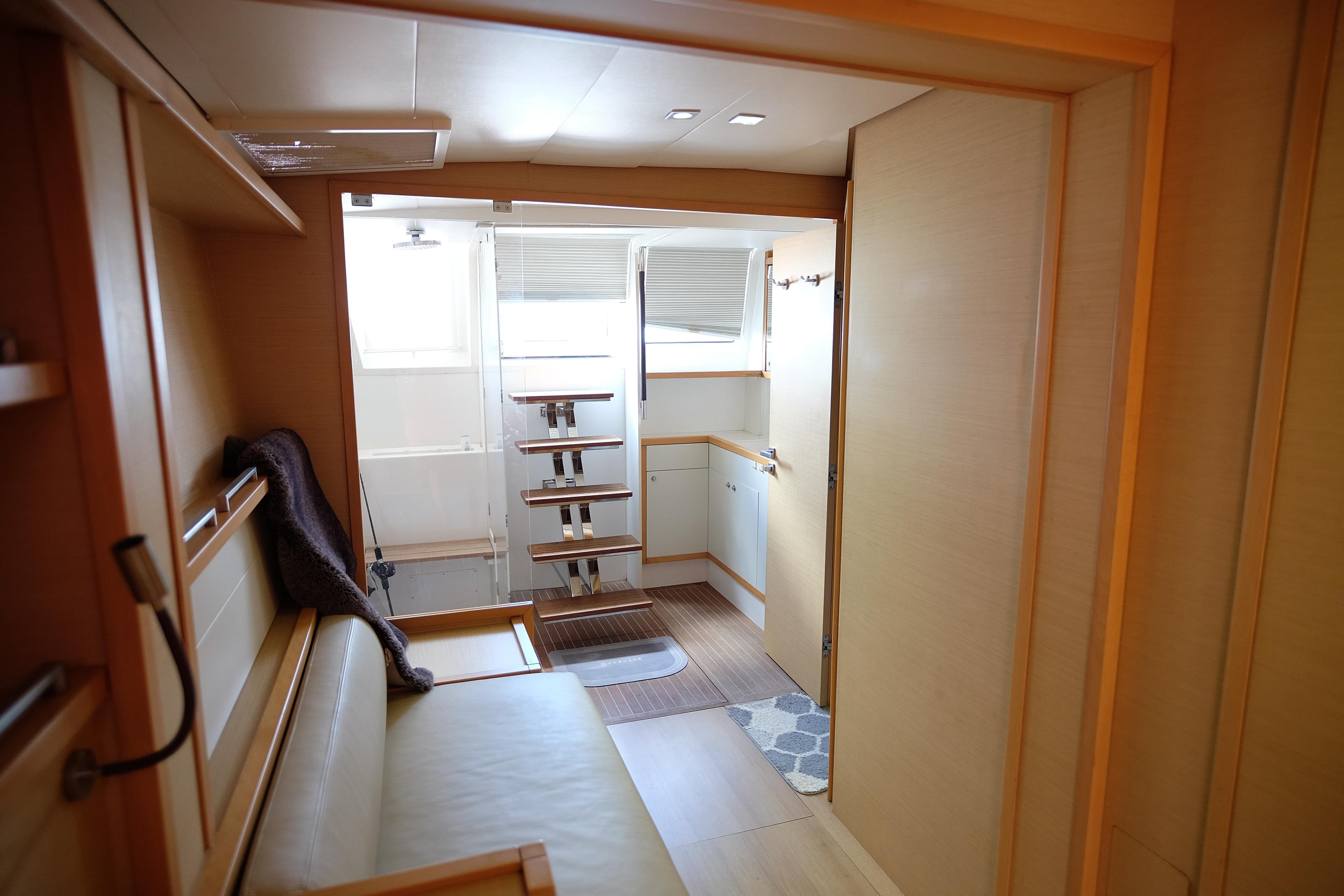 Interior of 2011 Lagoon 620 yacht with modern wooden design and cozy seating area.