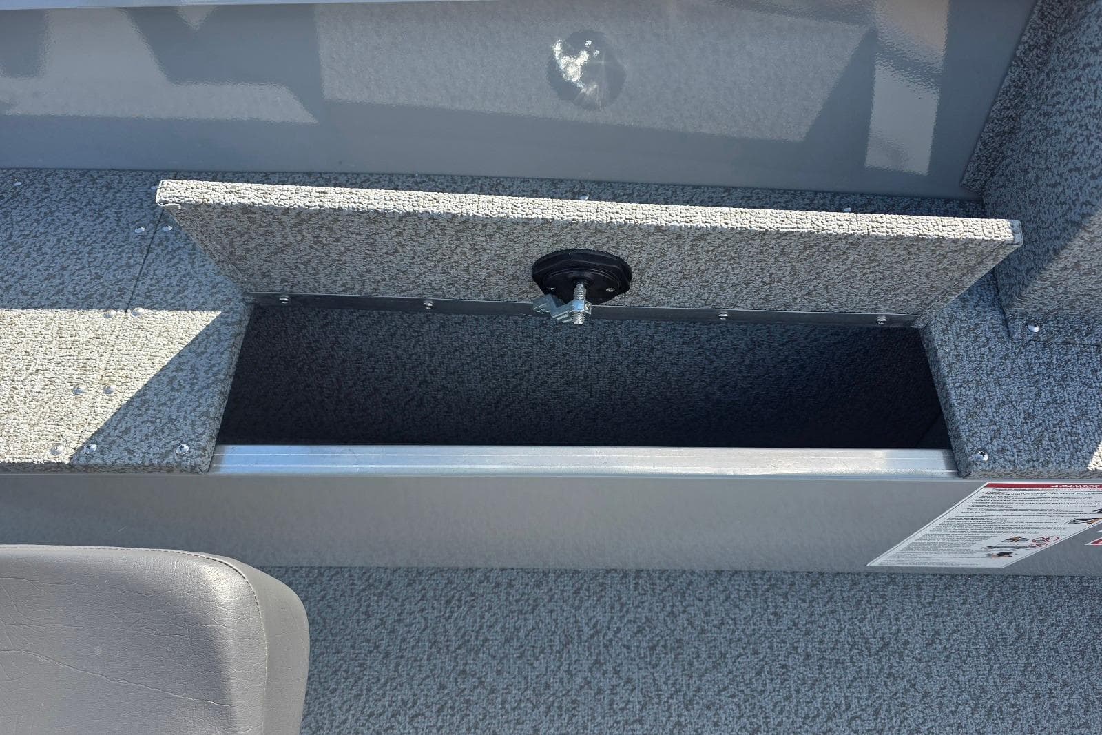 2026 Smoker Craft Freedom 160 TL boat storage compartment with open lid.