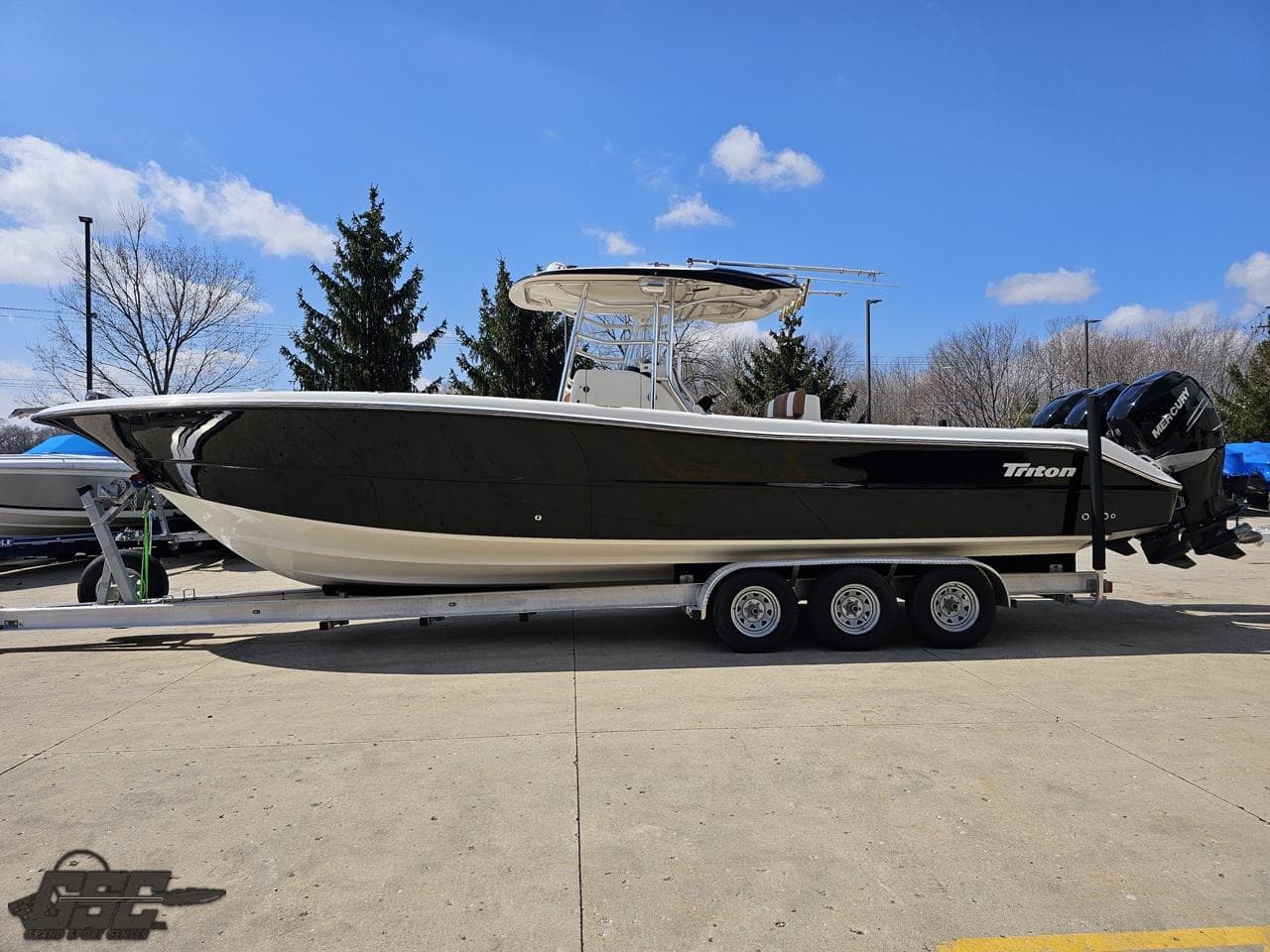 2007 Triton 351 CC boat on a trailer in a parking lot.