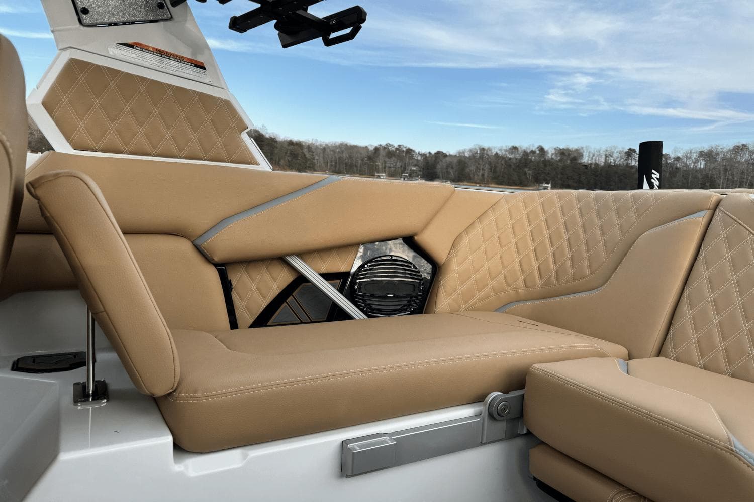 2024 Tigé RZX22 boat interior with tan leather seats and diamond stitching.