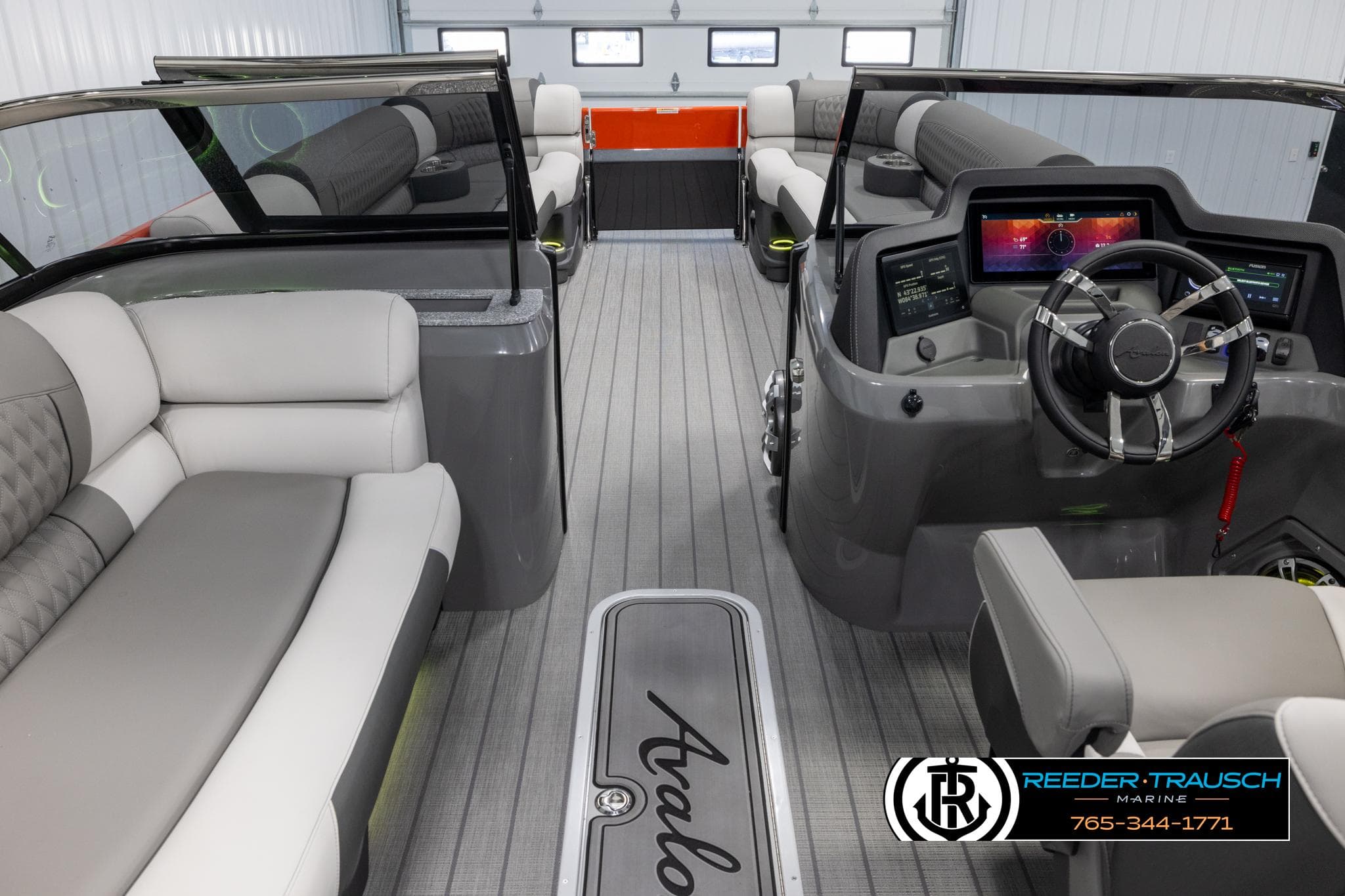 2024 Avalon 2785 Excalibur EL luxury pontoon boat interior with modern dashboard and plush seating.