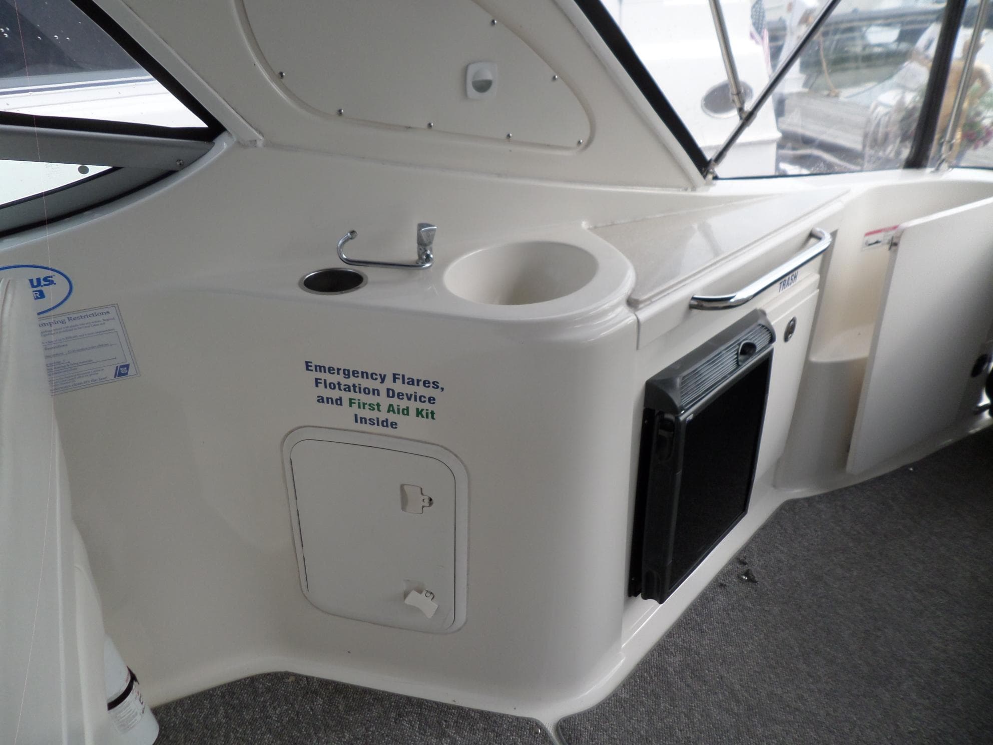 2008 Bayliner 320 Express boat interior with emergency equipment storage.