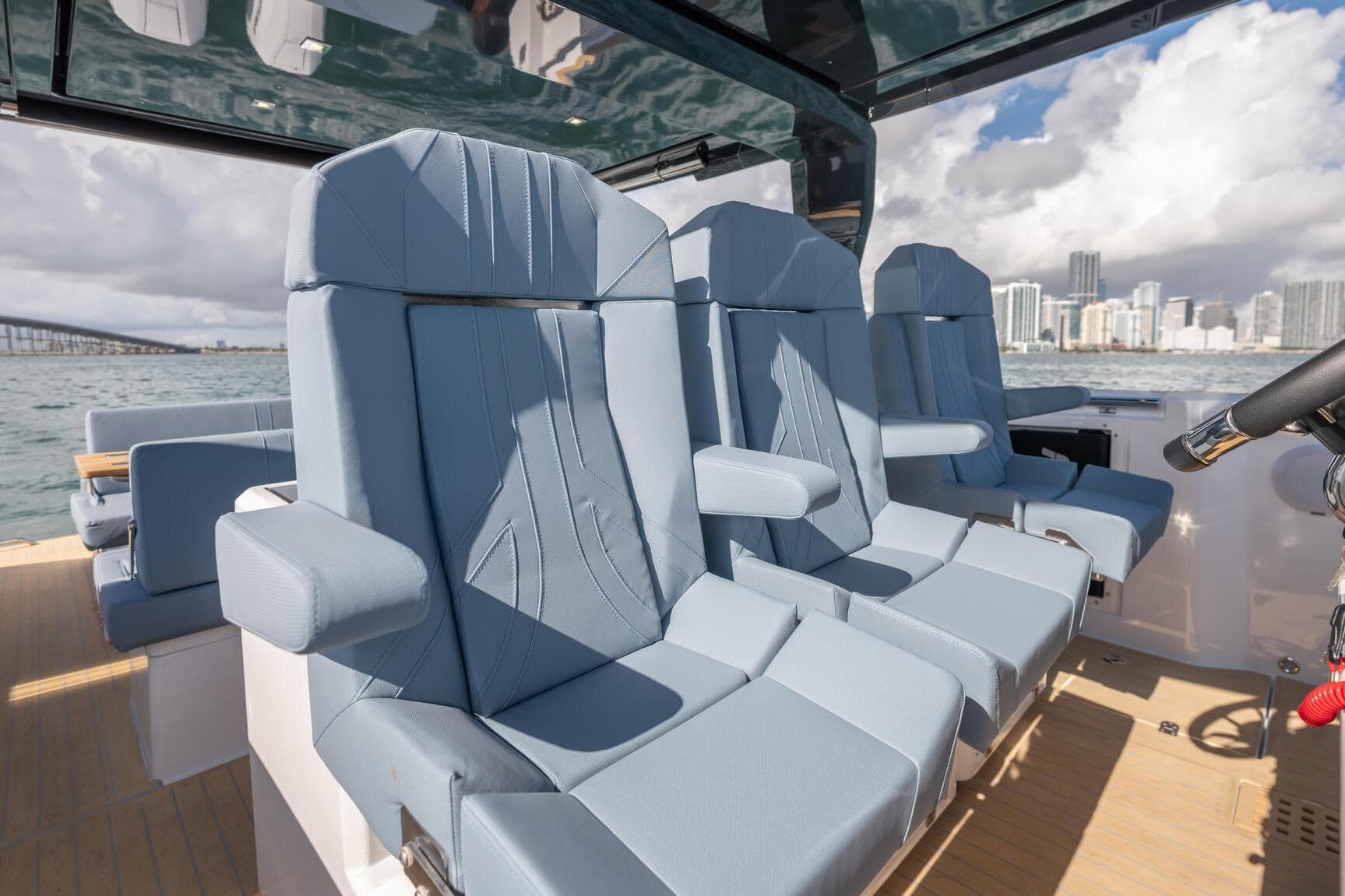 Luxurious seating on 2026 Fjord 39 XP yacht, featuring modern design and ocean backdrop.