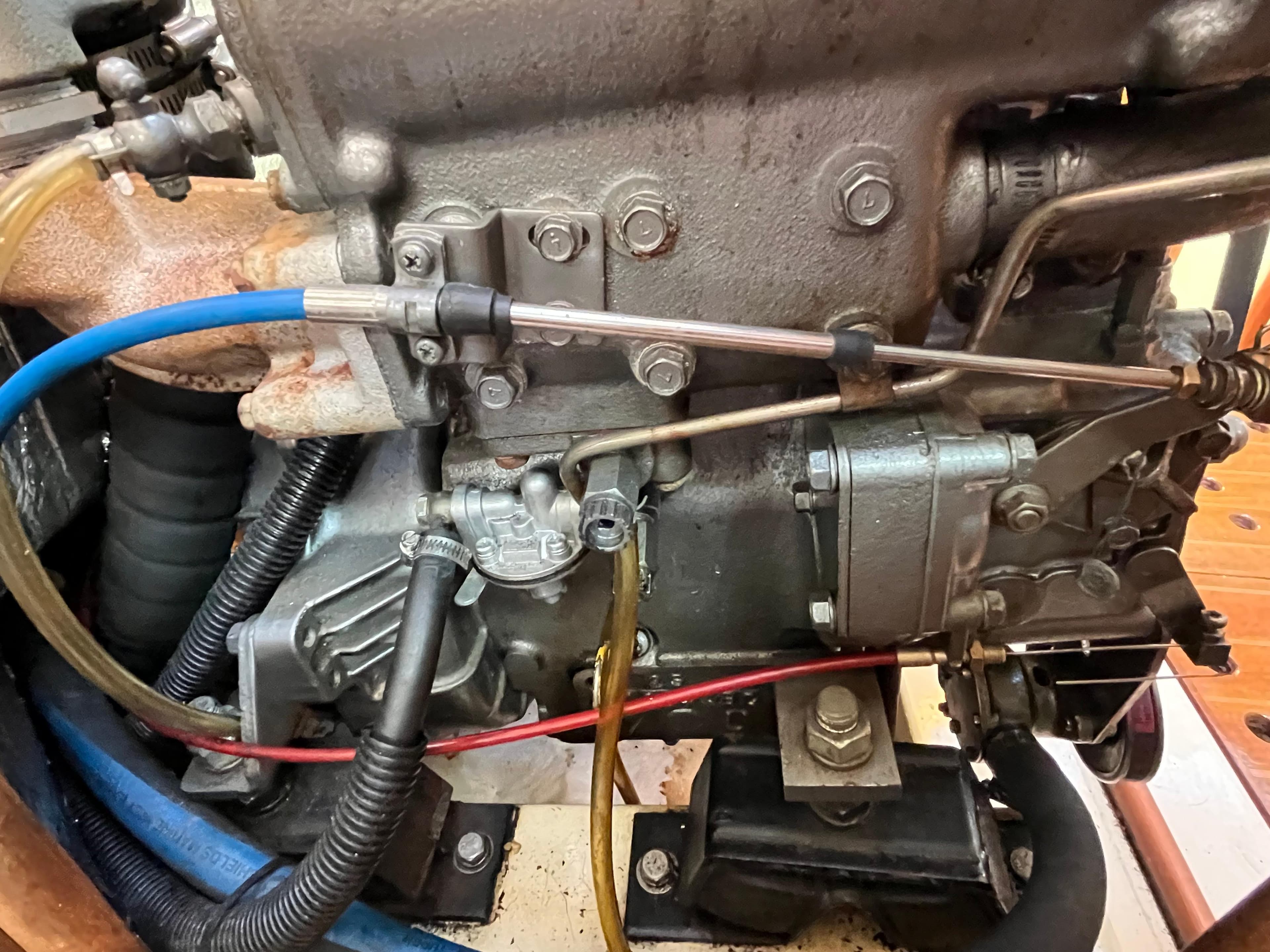 Close-up of a 1992 Hunter 30-2 engine with visible hoses and components.