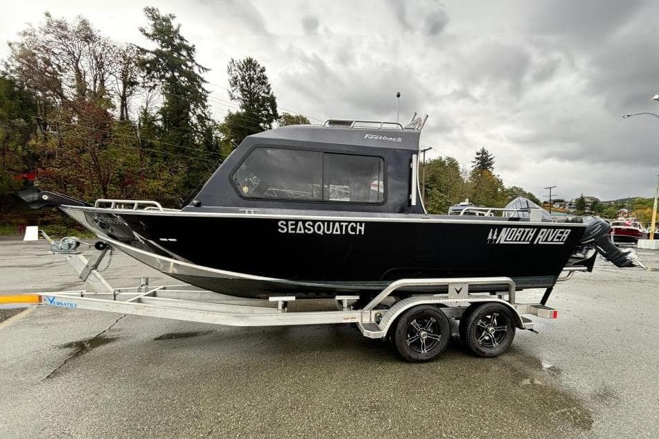 2024 North River 21 Fastback boat on trailer, labeled "SEASQUATCH," in a parking lot.