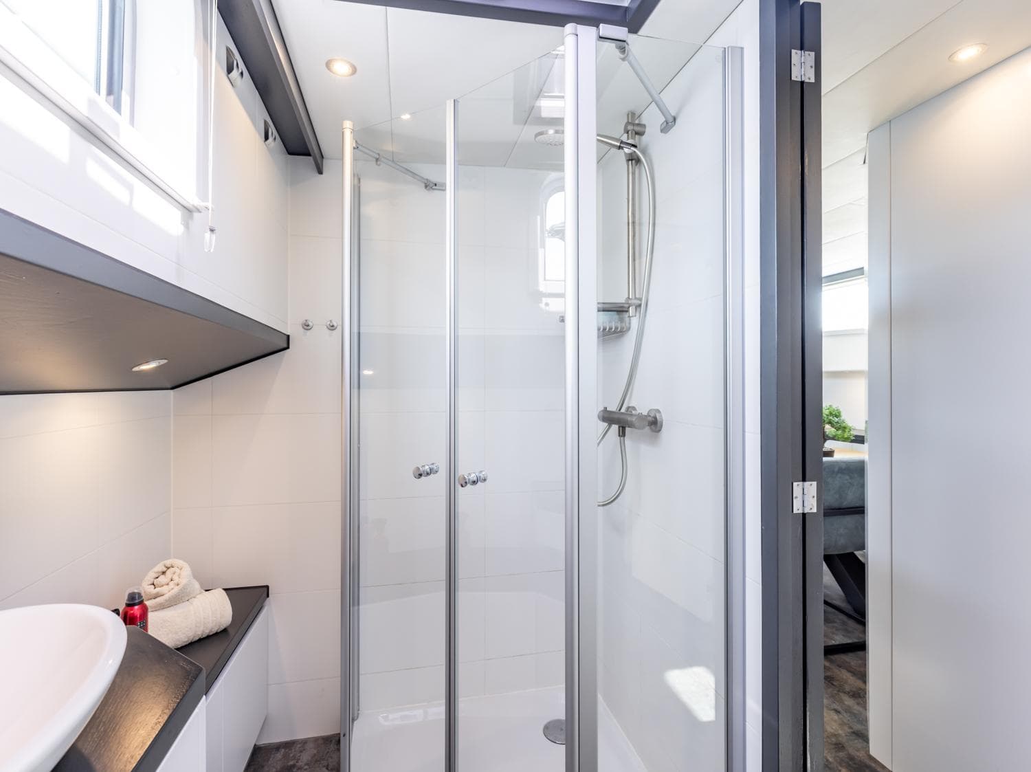 Modern shower area in 2013 Bekebrede Luxemotor yacht, featuring sleek glass doors and contemporary fixtures.