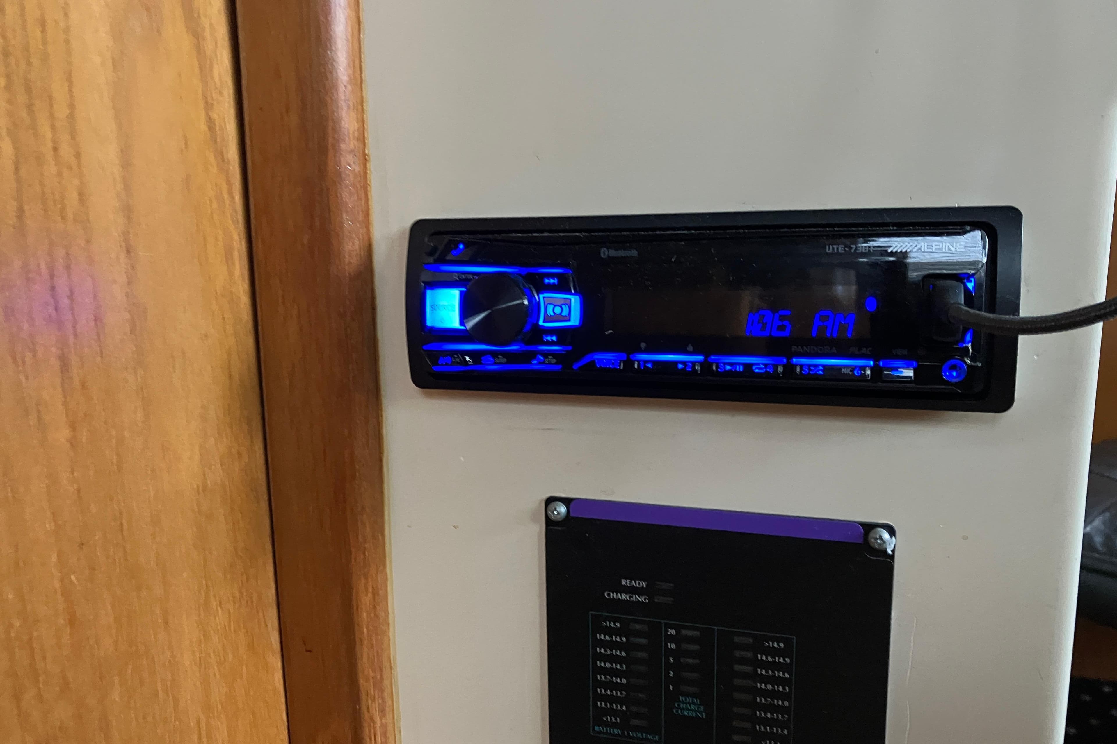 Boat stereo system in 1987 President 37 Sundeck, displaying 106 AM frequency.