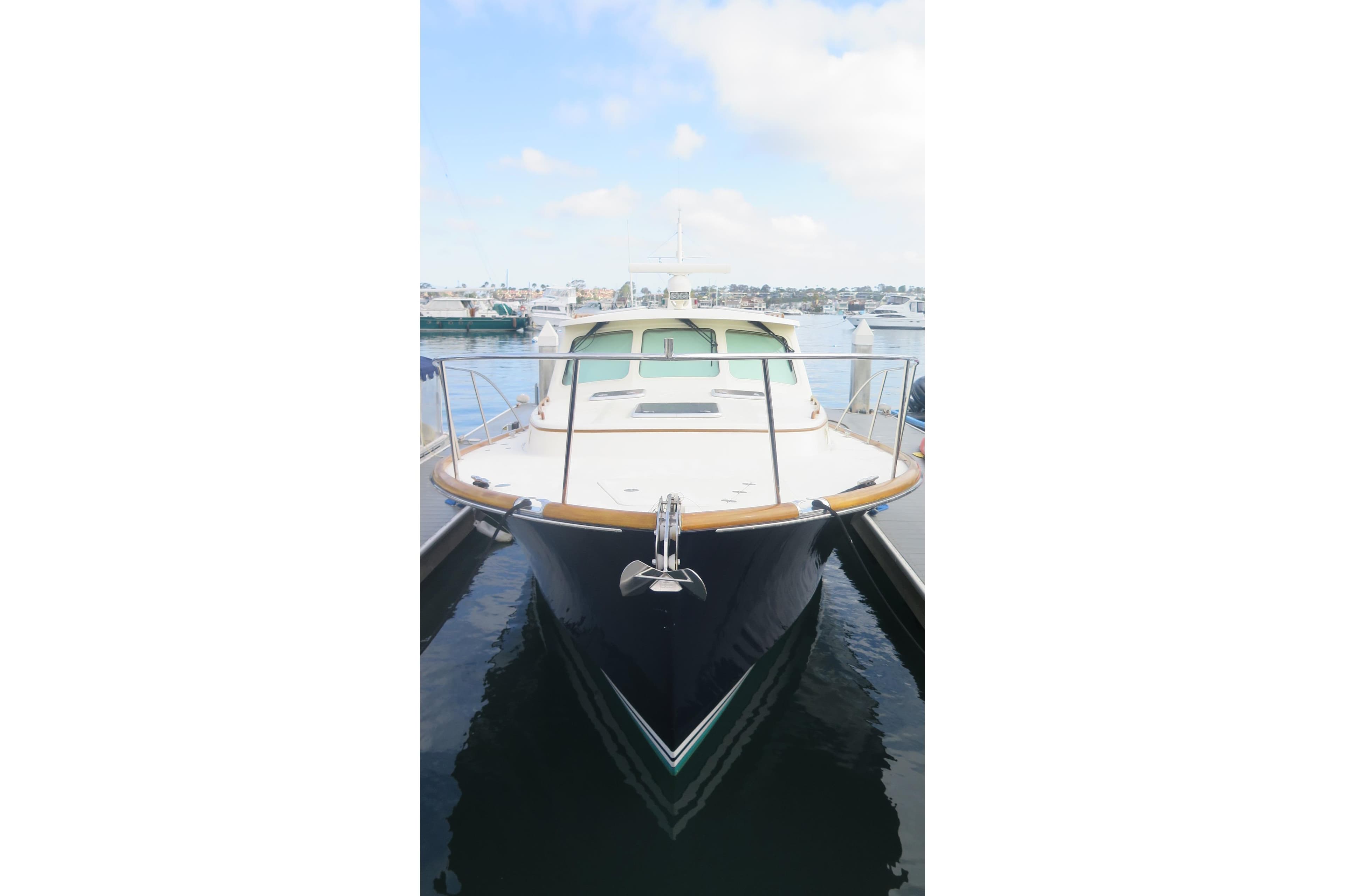 2007 Hinckley Talaria 40 yacht docked at marina, front view.