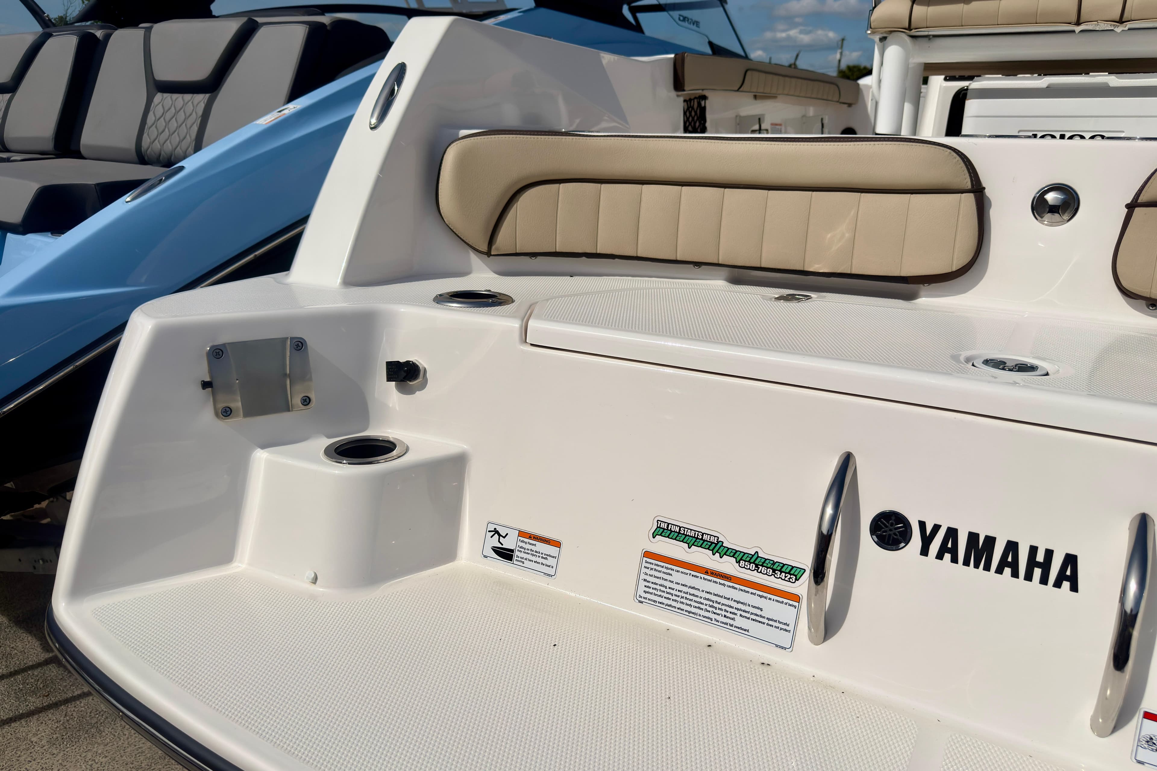 2025 Yamaha Boats 222 FSH Sport interior with beige seating and branding.