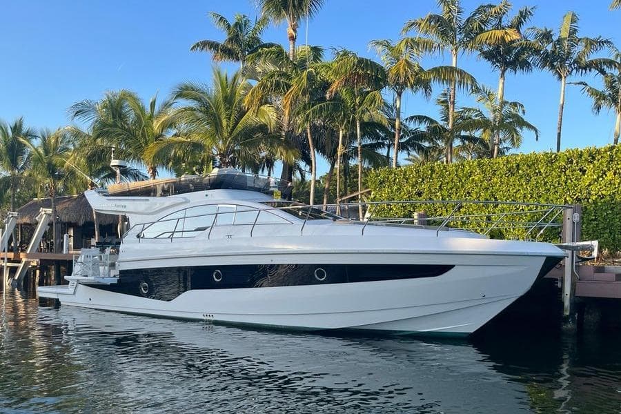 Luxury 2019 Schaefer 510 GT Pininfarina yacht starboard side at dock.