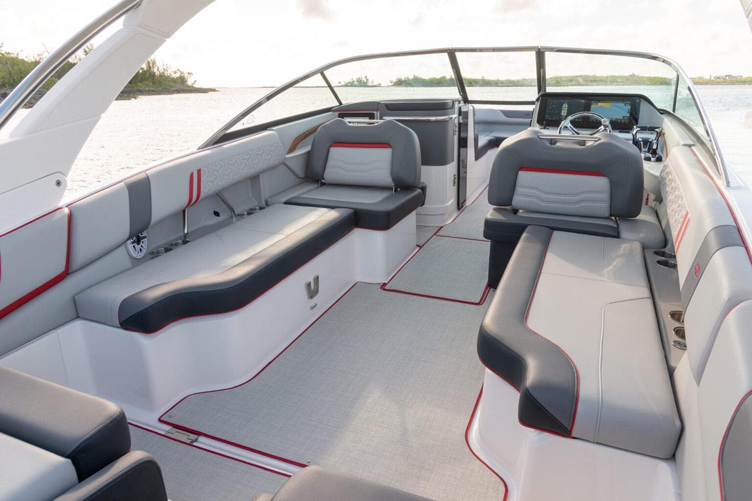 Manufacturer Provided Image: 2026 Regal LX9 boat interior with sleek seating and modern dashboard on open water.
