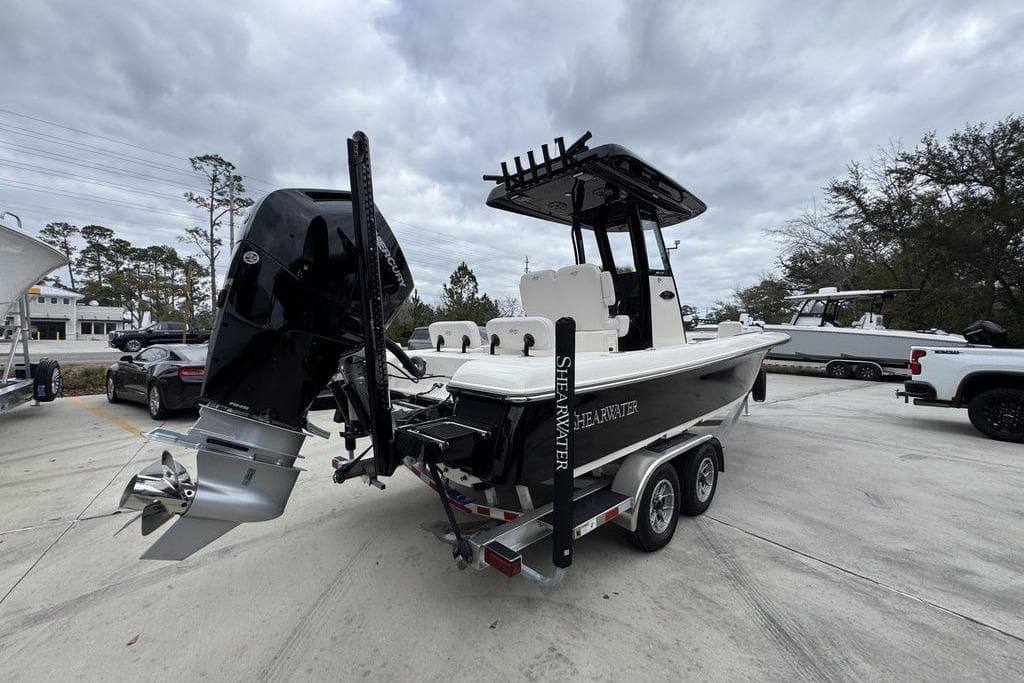2026 ShearWater 260 Carolina Flare boat on trailer, featuring powerful outboard motor.