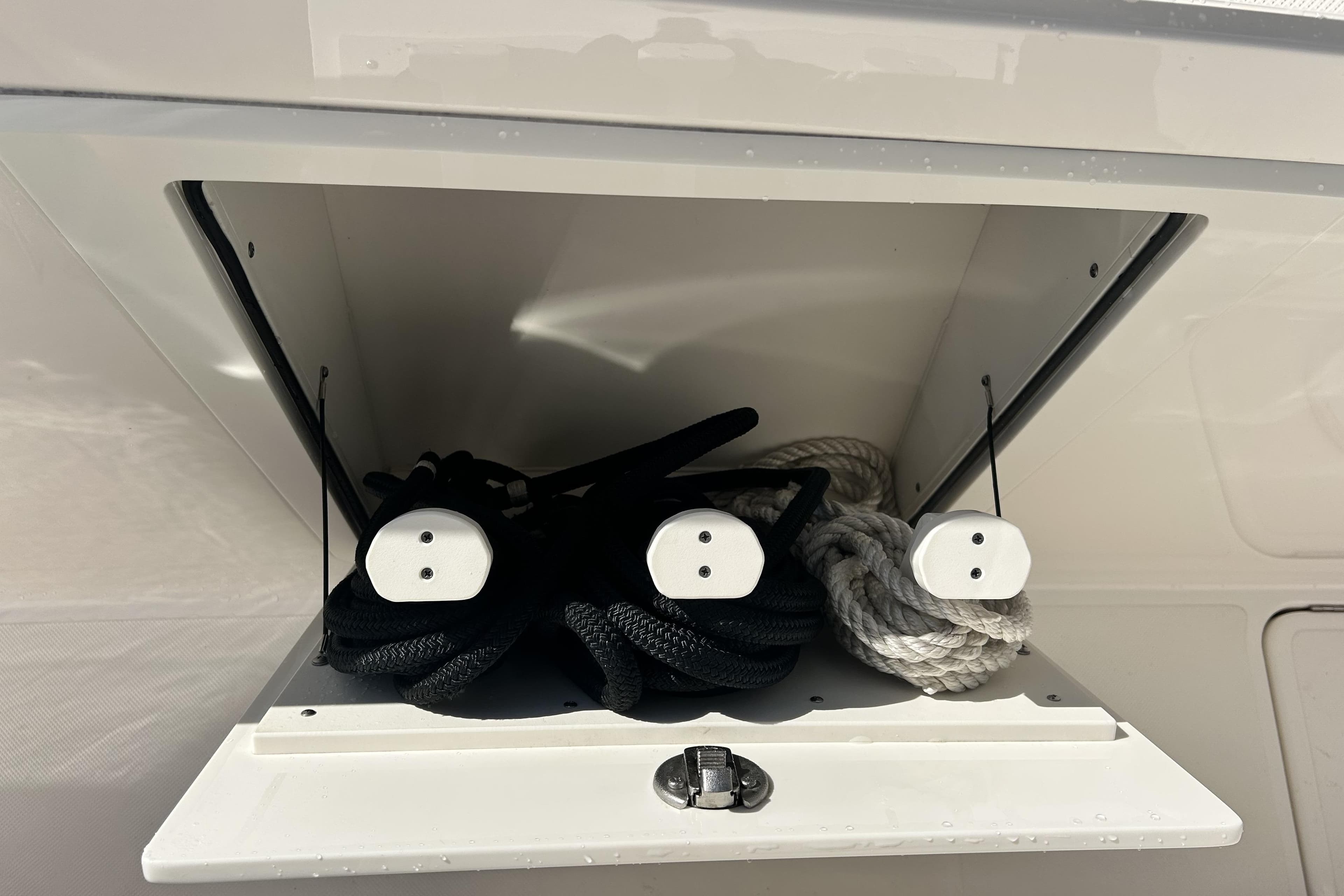 Storage compartment with ropes on a 2023 Tiara Yachts 38 LS.