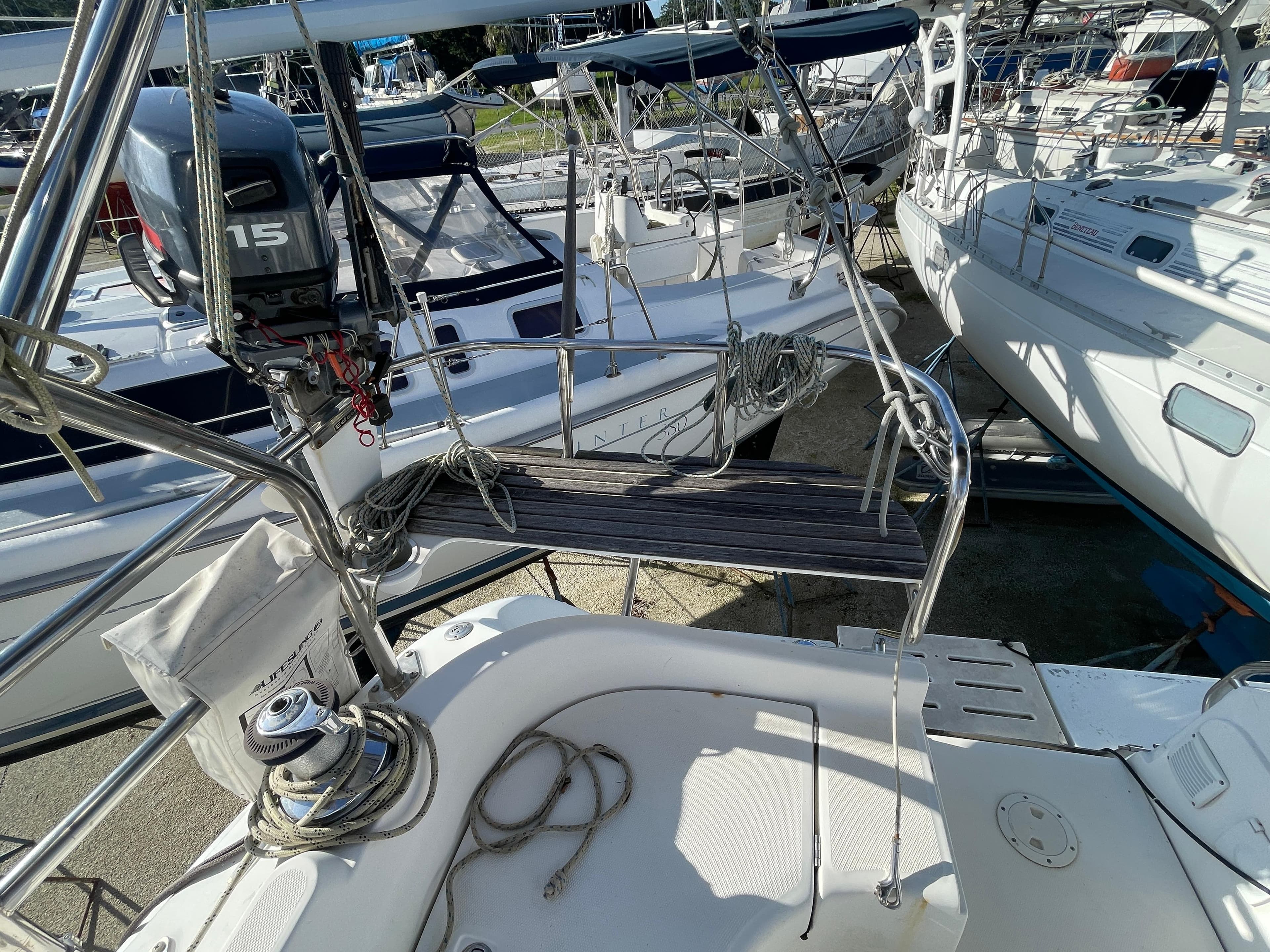 Hunter 44 DS Deck Salon 2004 sailboat with outboard motor and deck equipment.
