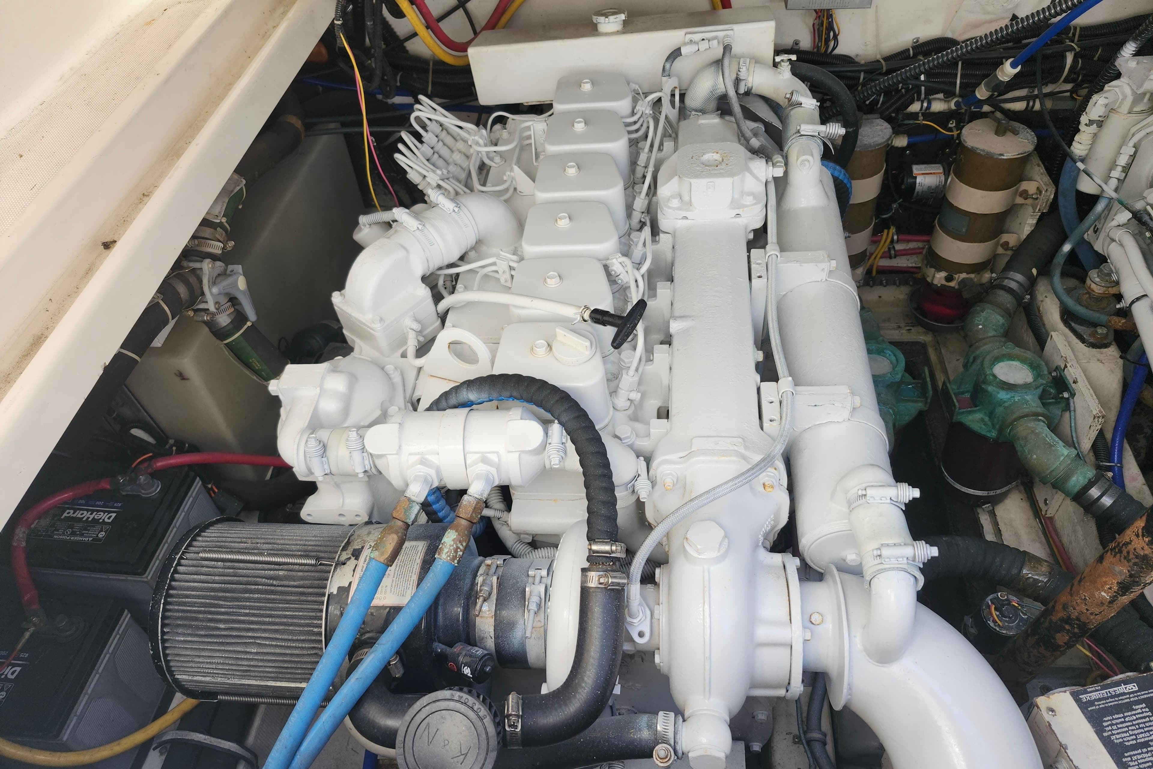 Engine compartment of a 2000 Tiara Yachts 3100 Open, showcasing a clean, well-maintained engine.