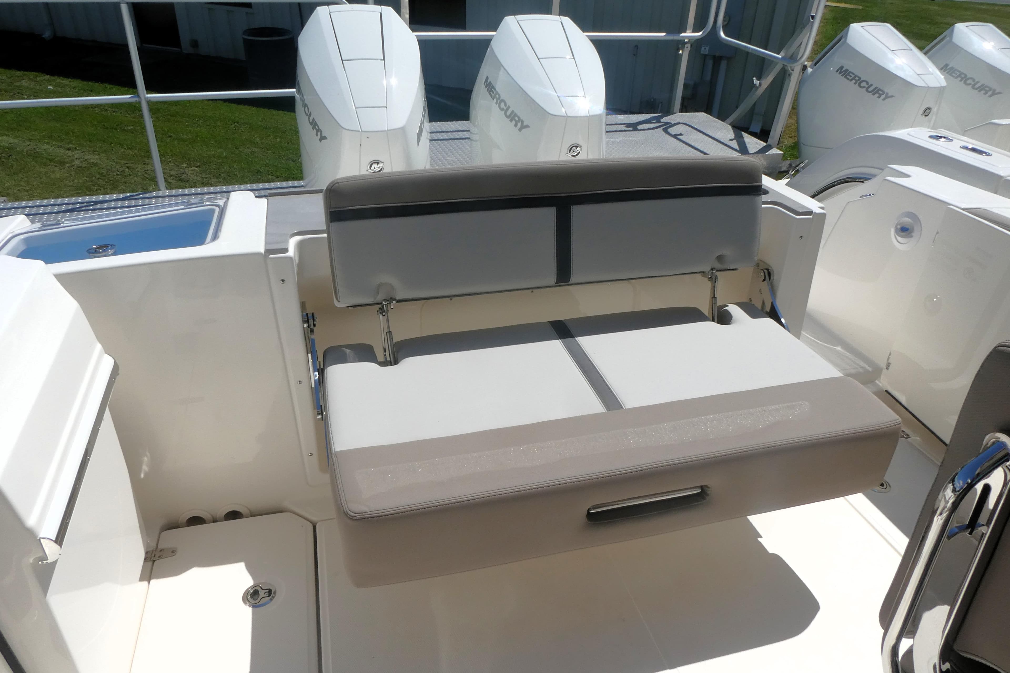 2026 Boston Whaler 330 Vantage boat interior with seating and Mercury engines.