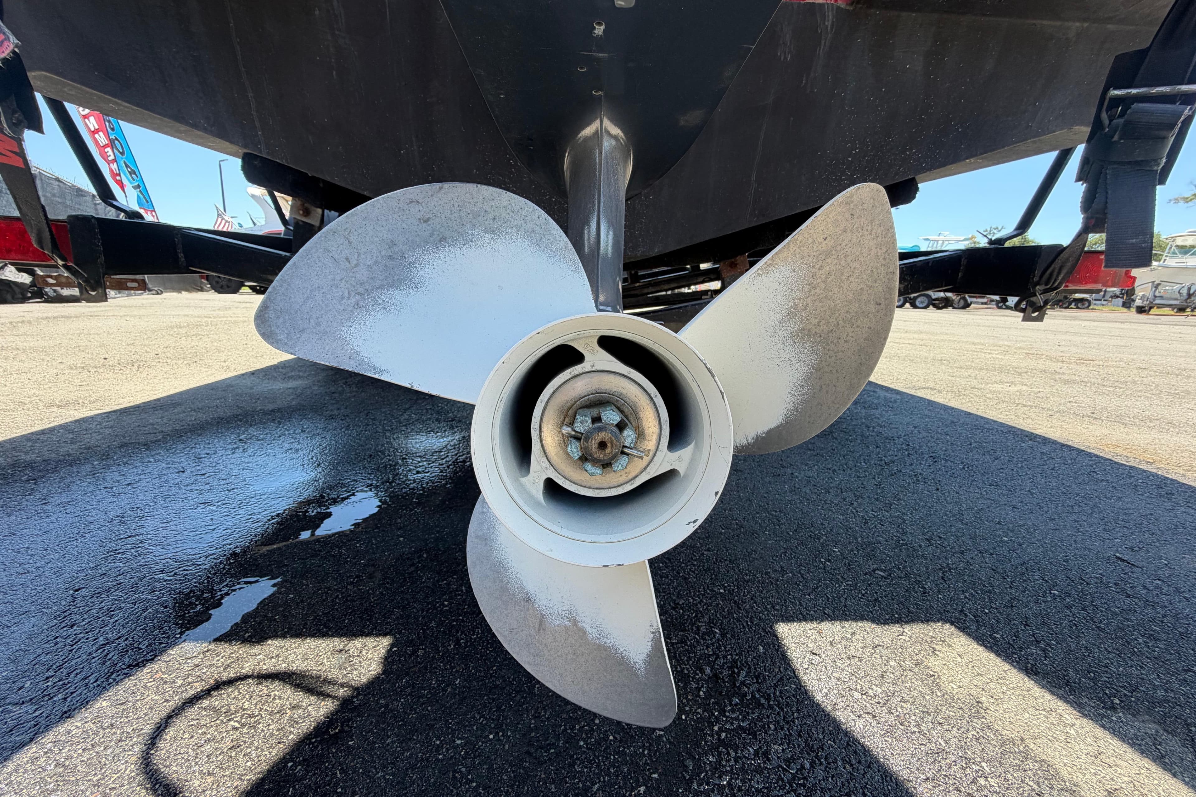 Propeller of 2022 Hurricane SunDeck Sport 185 OB boat on trailer.
