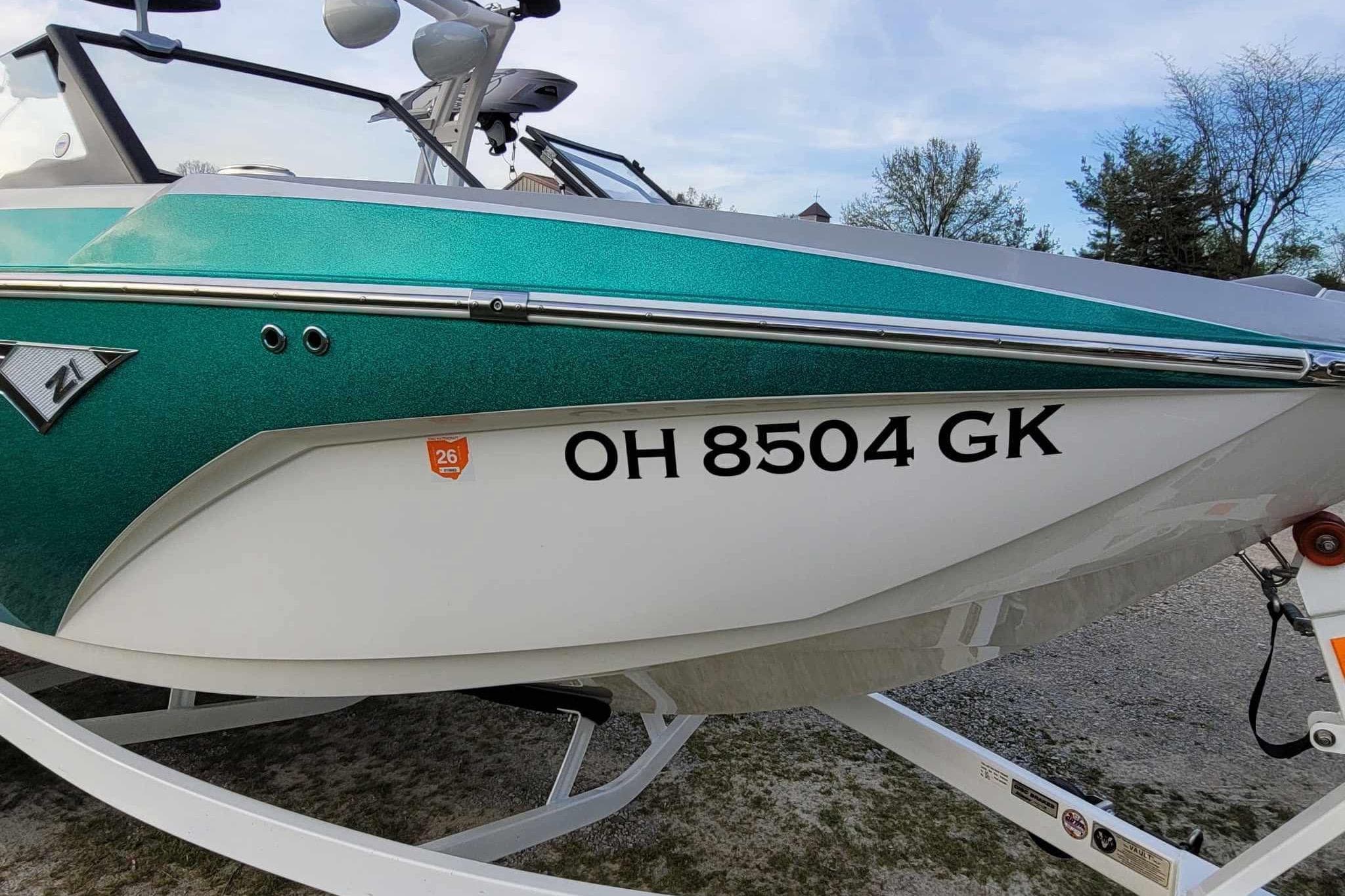 2022 Tigé Z1 boat with registration OH 8504 GK, teal and white color scheme.