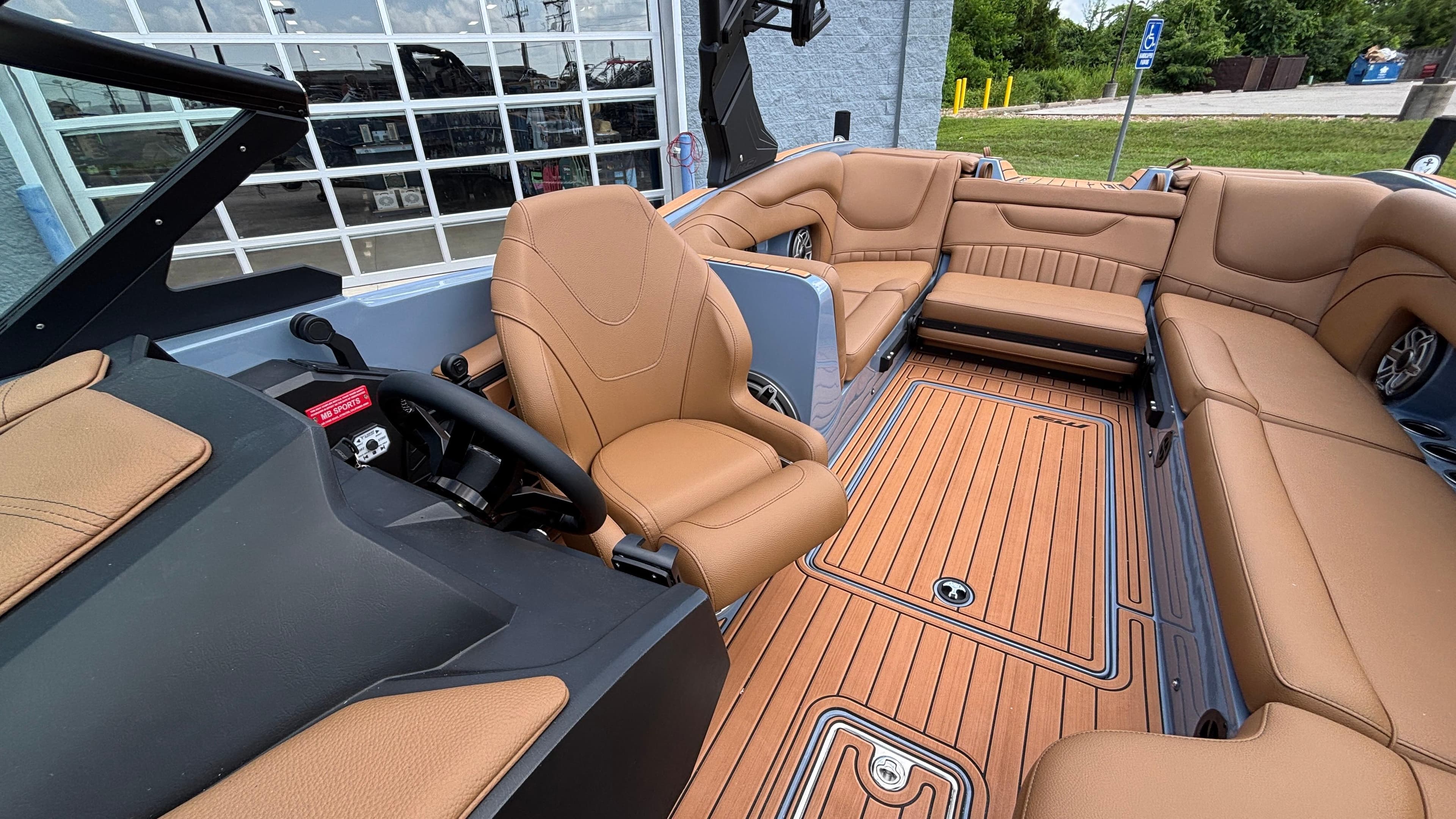 Luxurious interior of 2025 MB B52 23 Alpha boat with tan leather seating.