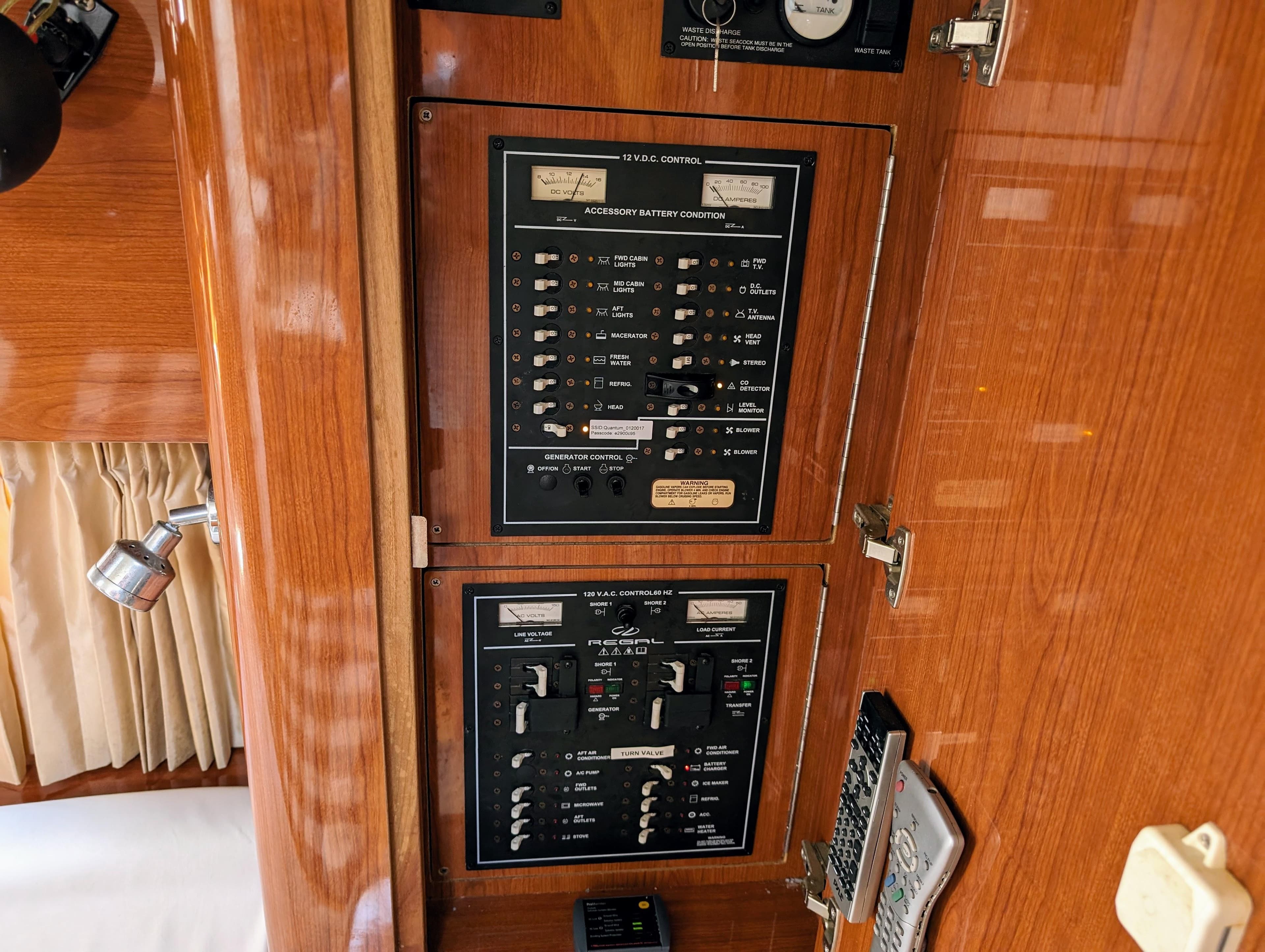 Control panel inside a 2005 Regal 3560 boat, featuring switches and gauges.