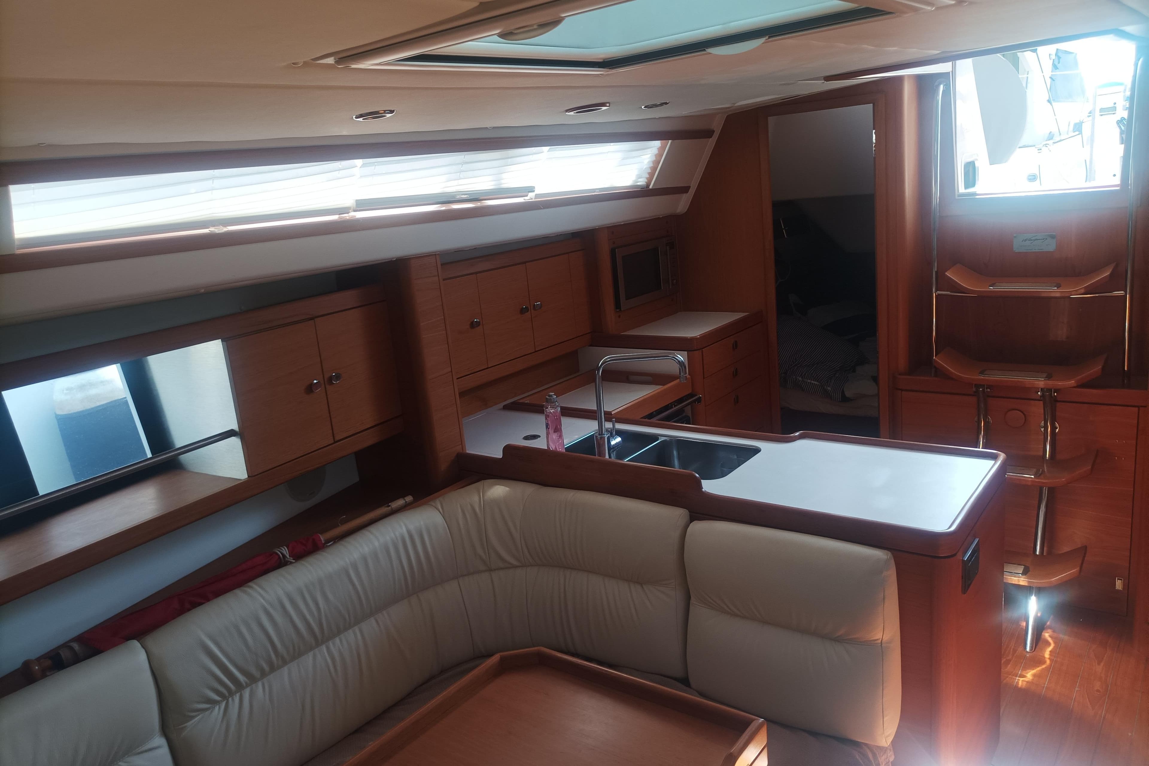 Luxurious interior of 2013 Wauquiez Centurion 40S.2 yacht with modern kitchen and seating area.