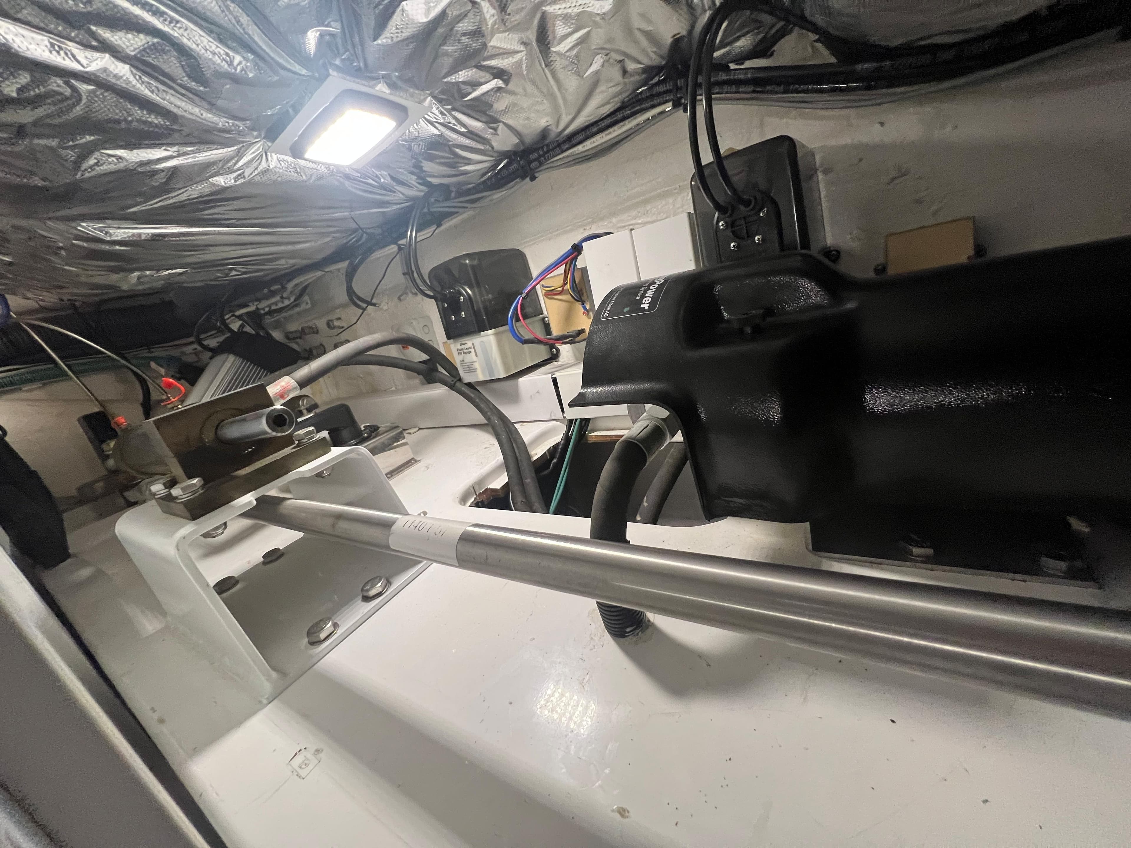Engine room of a 2018 Princess V58 yacht, showcasing mechanical components and wiring.