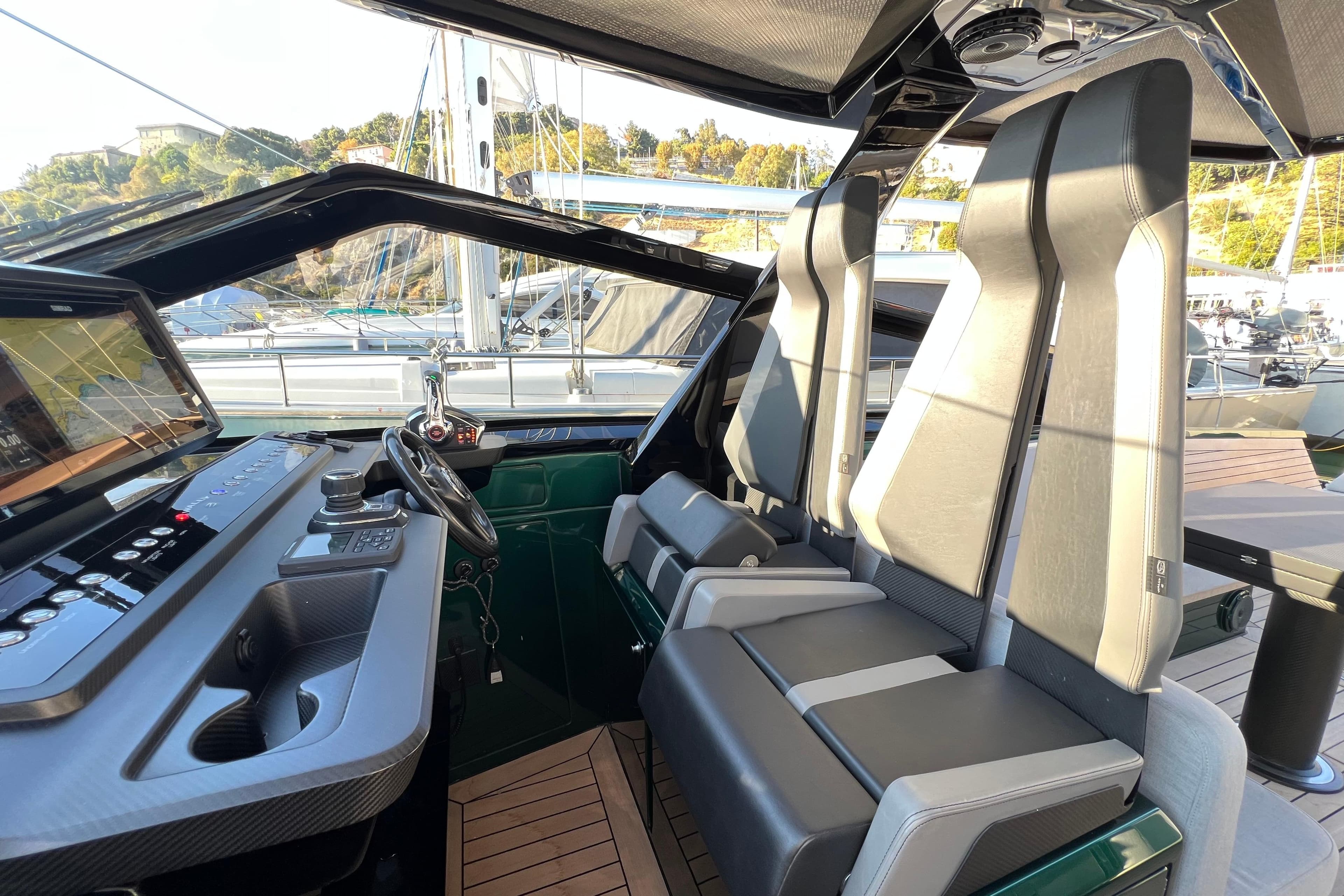 Interior of 2024 Wally Tender 43 X, featuring modern helm and sleek seating design.