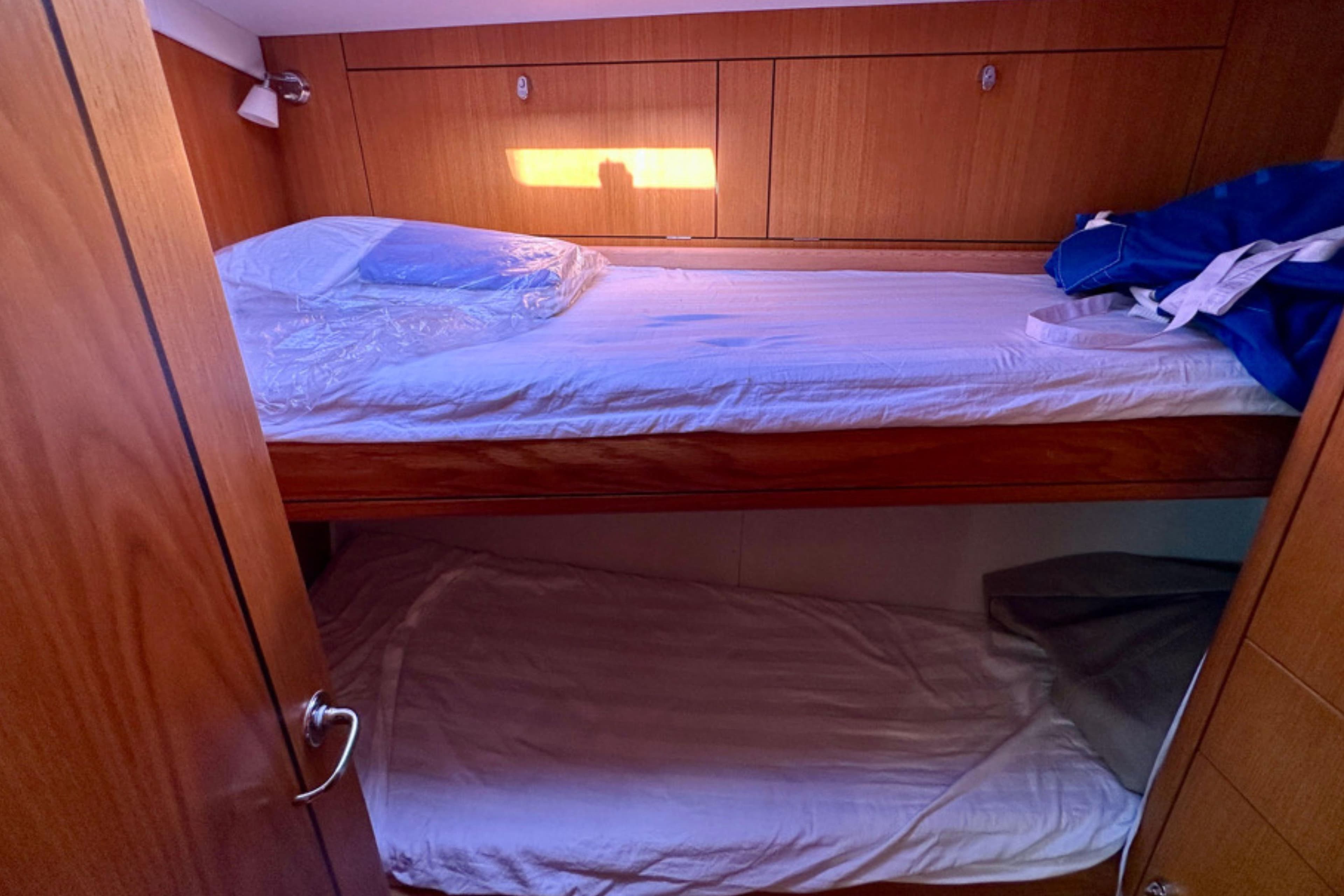 Bunk beds in 2006 Oyster 46 yacht cabin with wooden interior.