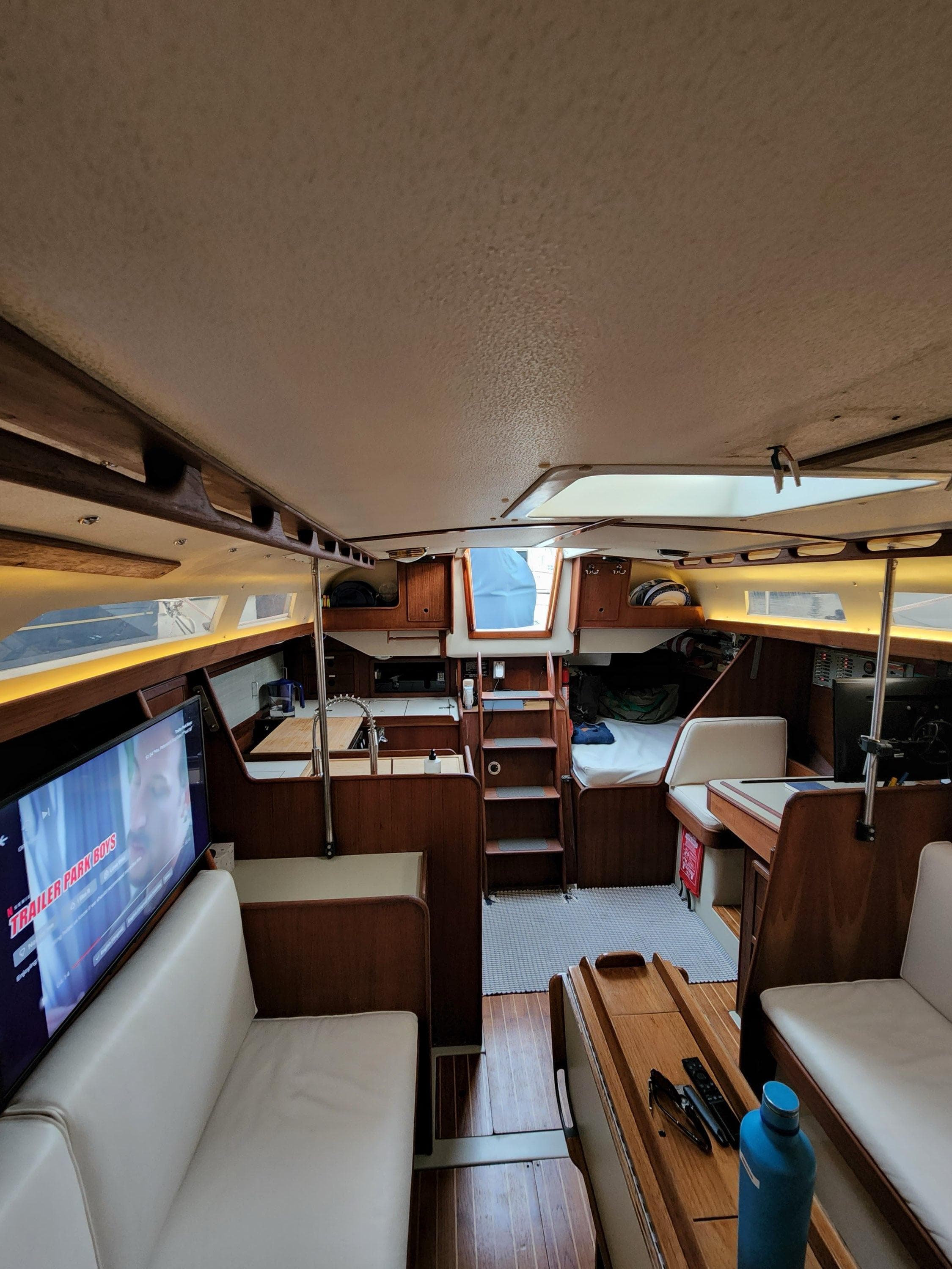 Interior of 1981 C&C 40-2 sailboat with cozy seating and modern amenities.