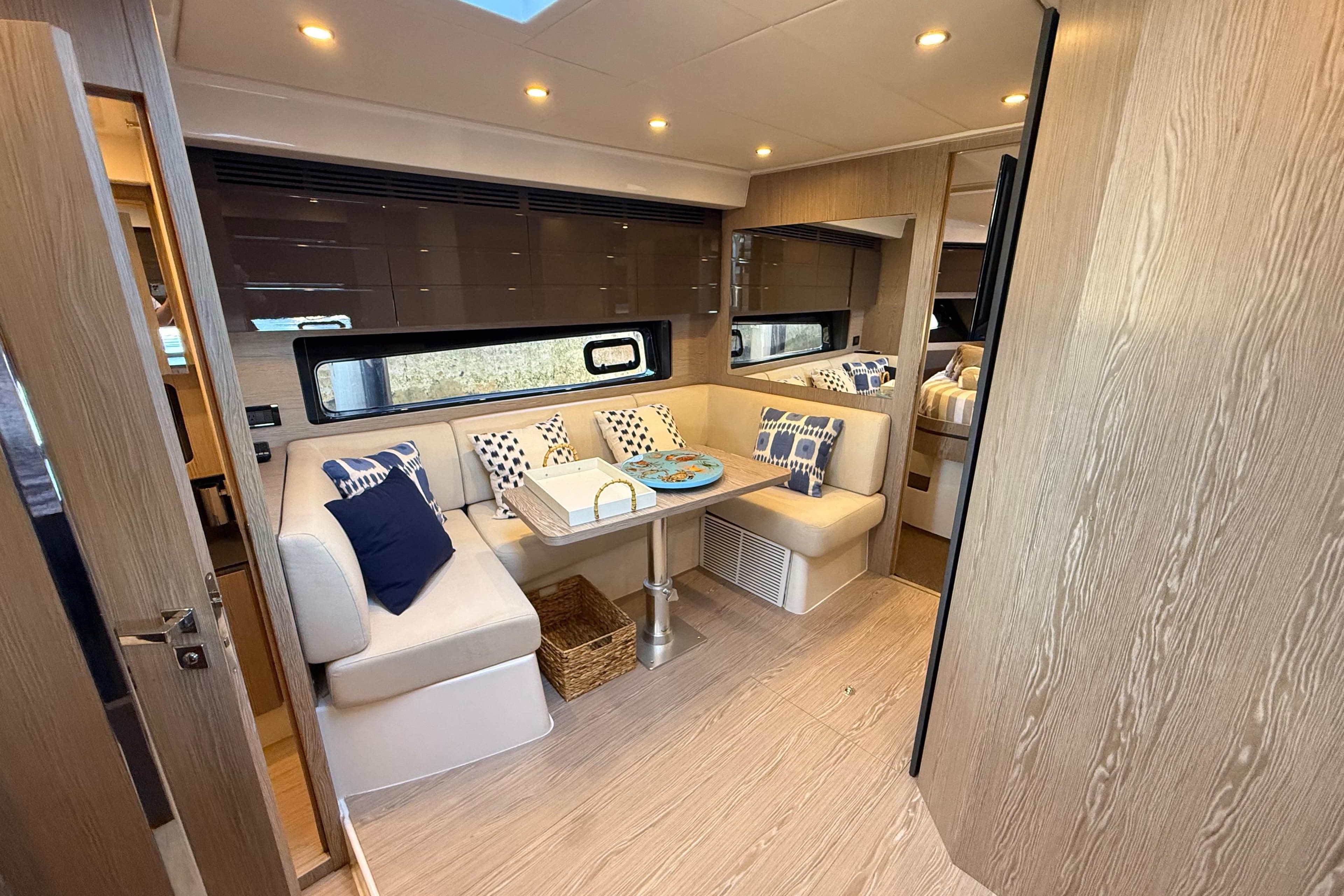 Luxurious interior of 2018 Azimut Atlantis 43 yacht with elegant seating and modern decor.