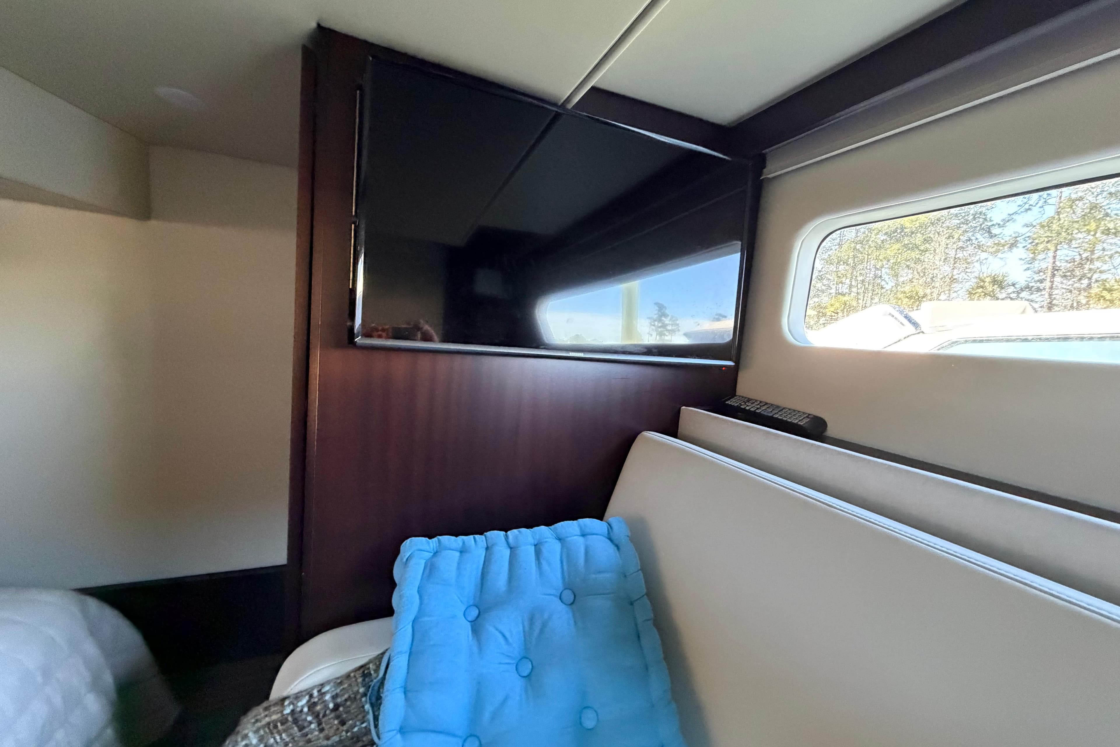 Interior of 2019 Regal 42 Grande Coupe with TV and window view.