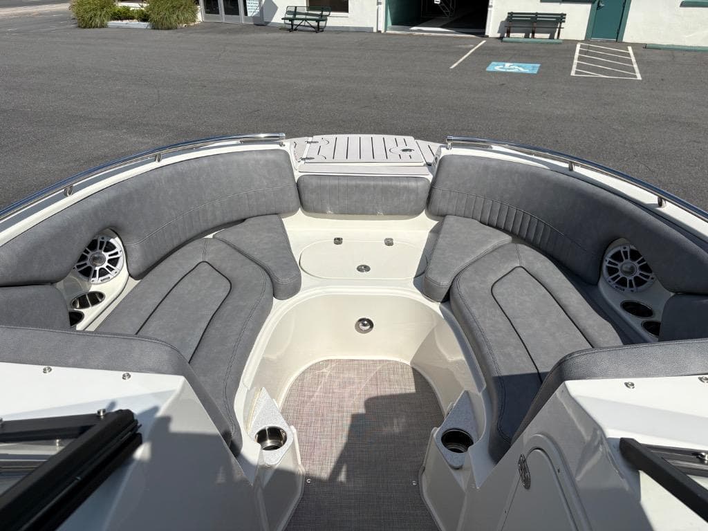 2021 Stingray 231 DC boat interior with gray seating and cup holders.
