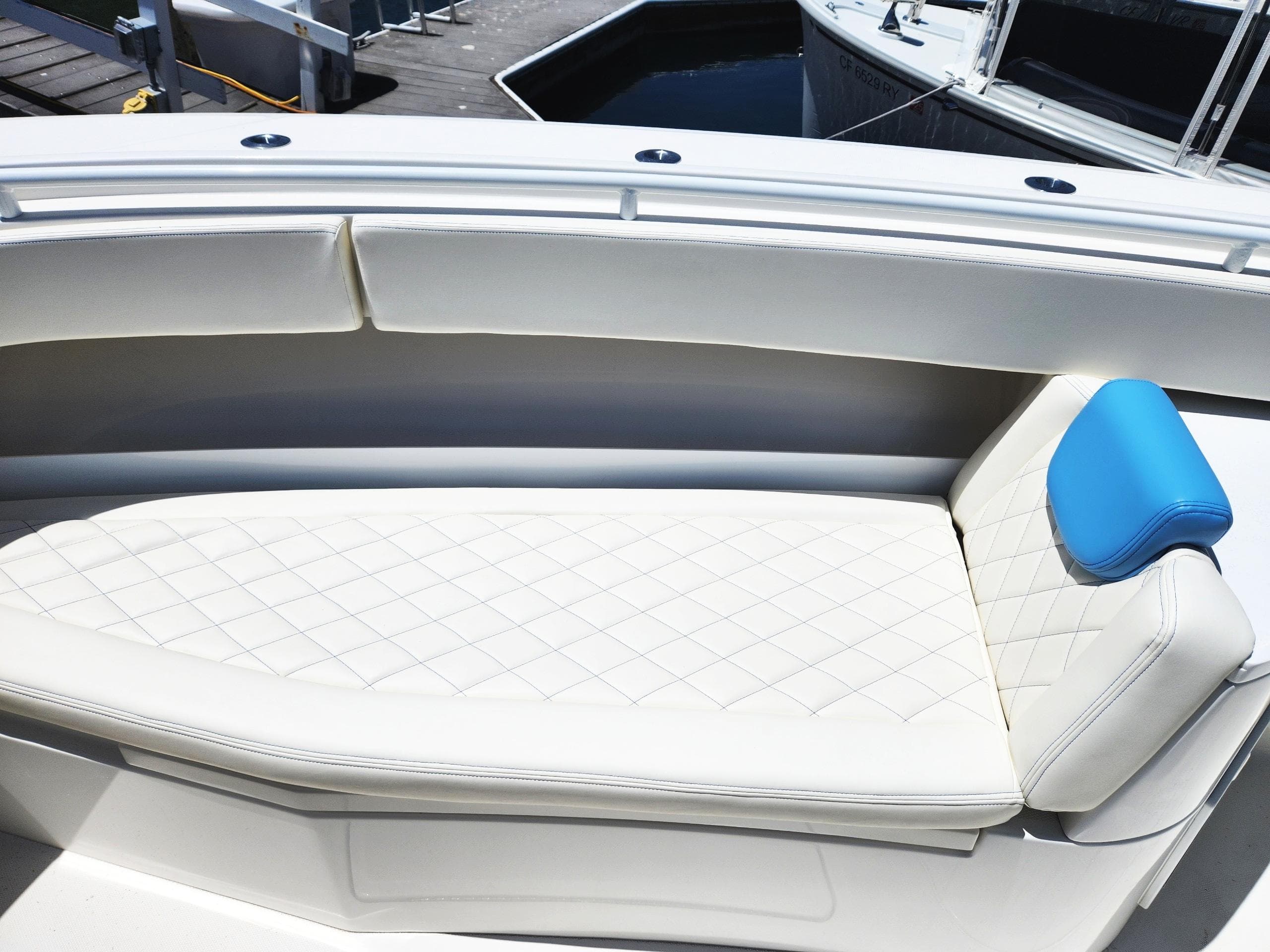 Luxurious seating on a 2018 HCB 39 Speciale boat with quilted upholstery.
