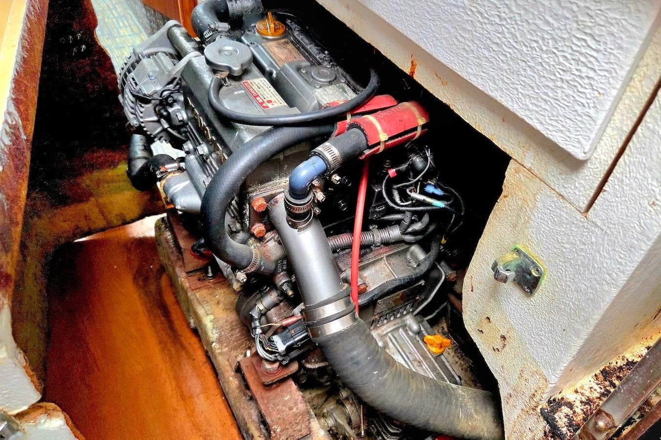 Engine compartment of a 1995 Catamaran St. Francis 43, showcasing mechanical components.