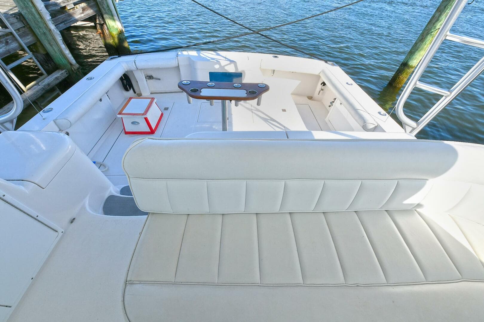 2007 Cabo 40 Express boat interior with seating and fishing rod holders.
