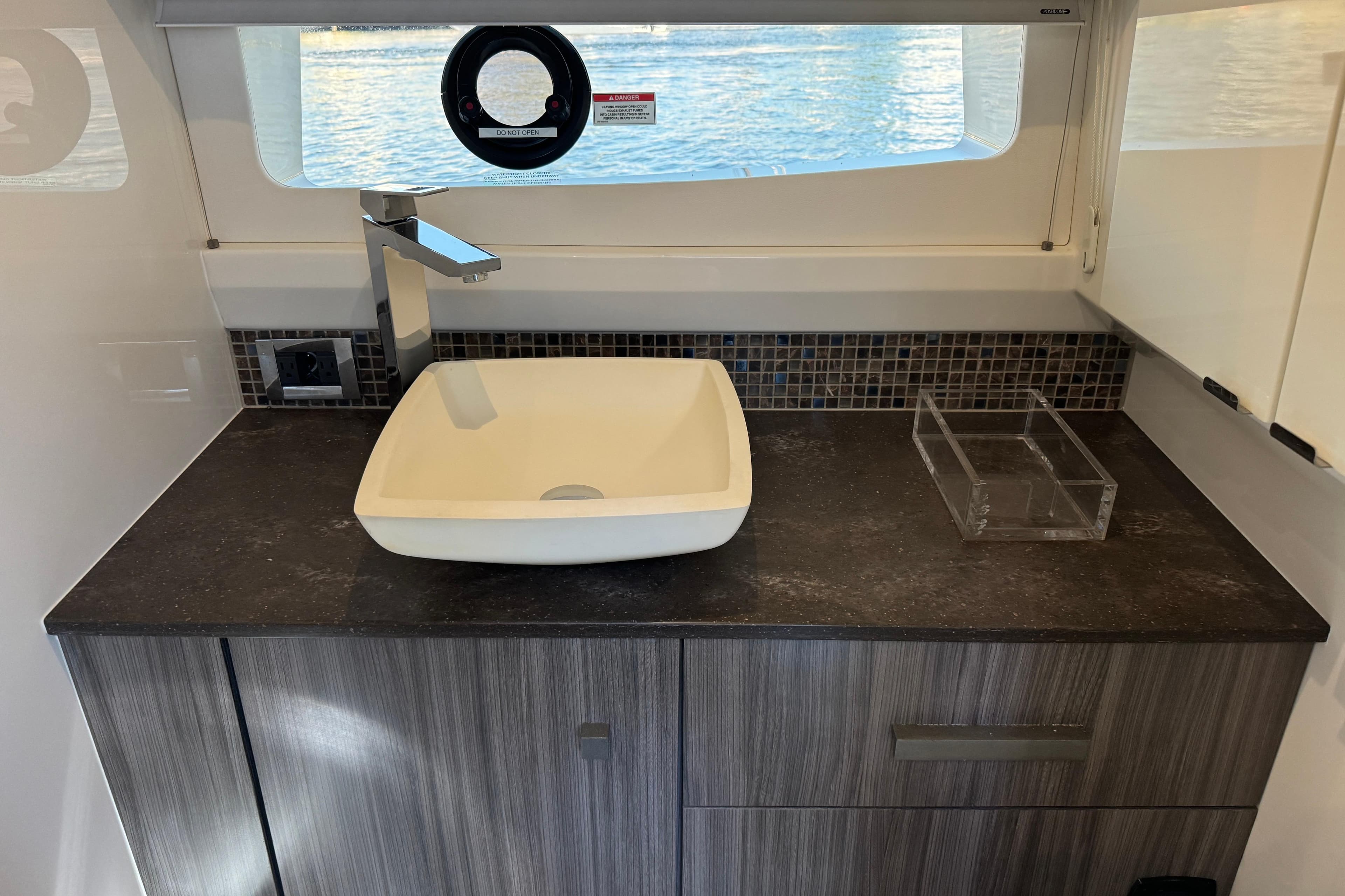 Modern bathroom sink in 2022 Sea Ray SLX 400 Outboard yacht interior.