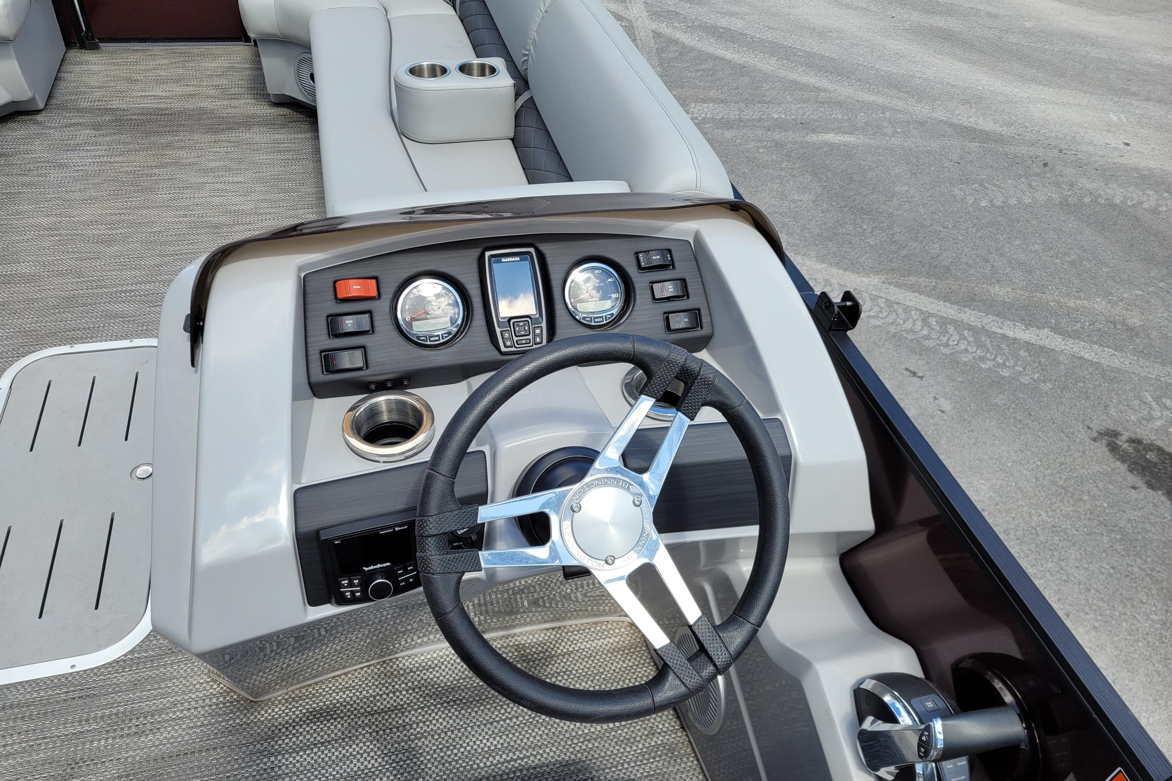 2021 Bennington 24 SSBX boat dashboard with steering wheel and control panel.