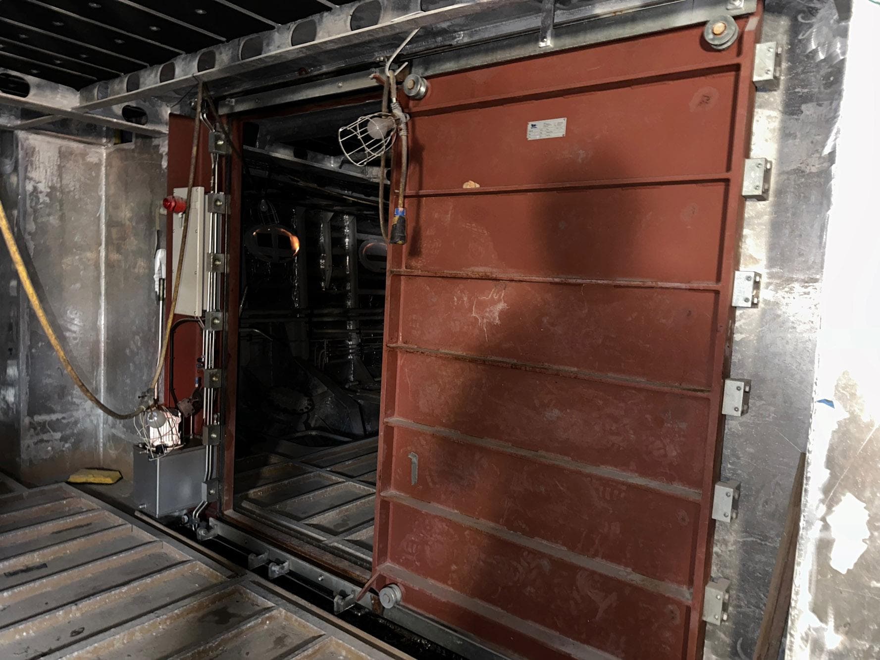 Engine room door of 2026 Trinity Yachts Custom T052, showcasing industrial design.