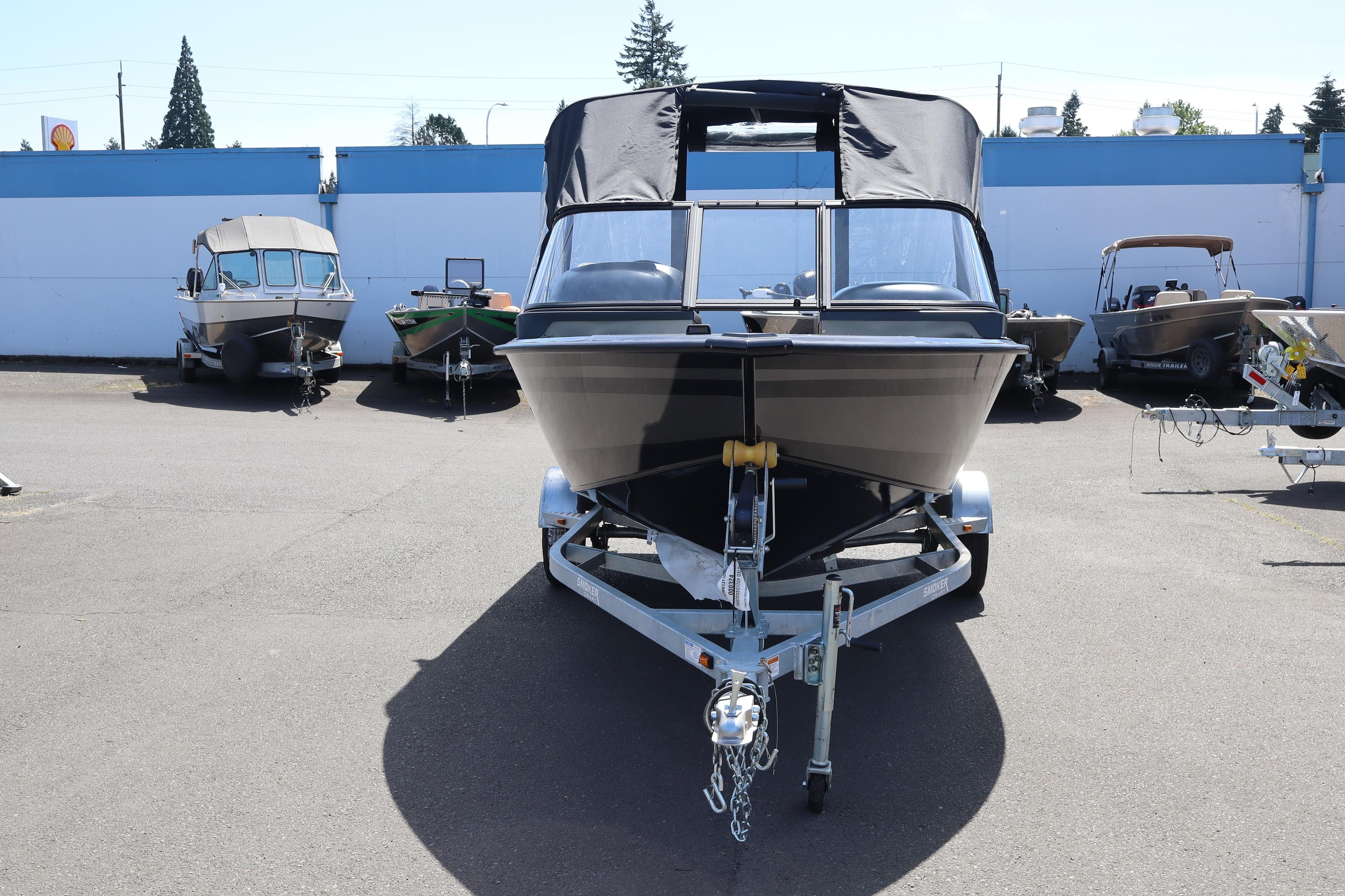 2026 Smoker Craft Osprey 172 boat on trailer, parked outdoors.