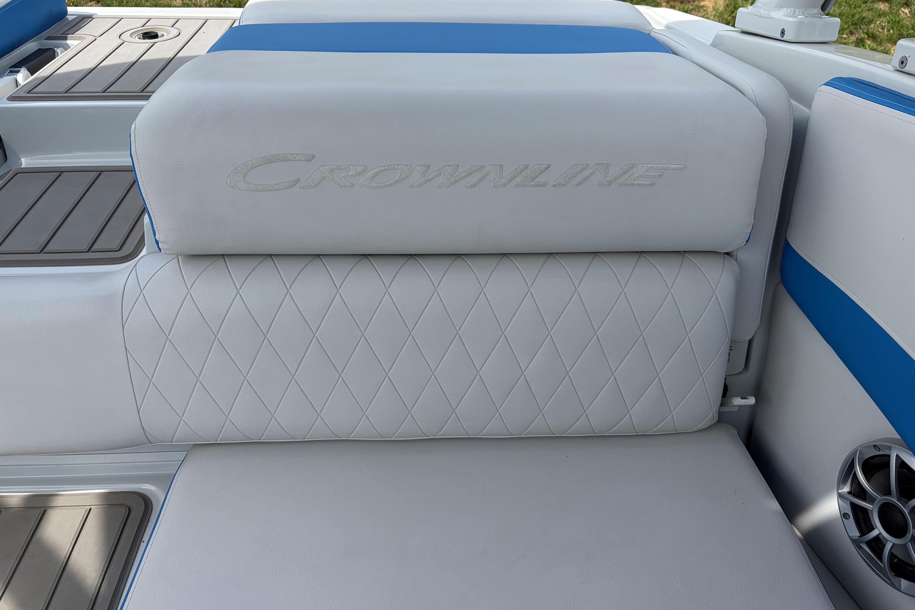 2025 Crownline 220 SS boat seat with white and blue upholstery, featuring diamond stitching.