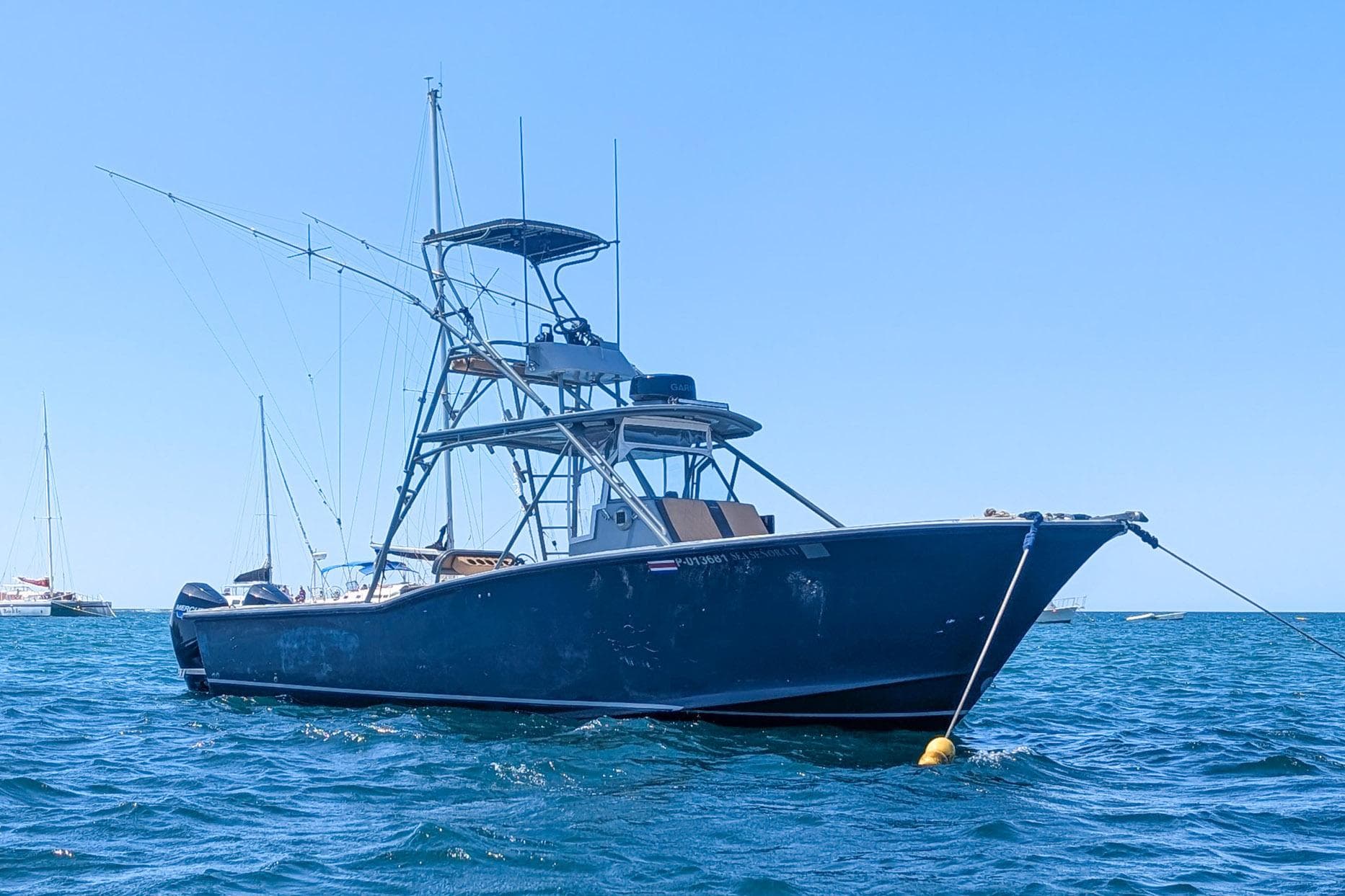 Ocean Master 34 boat from 1995 anchored on the ocean.